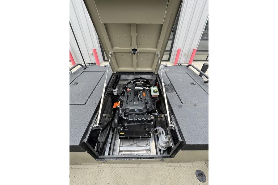 Open engine compartment of 2026 SeaArk Predator 300 AK boat, showcasing internal components.