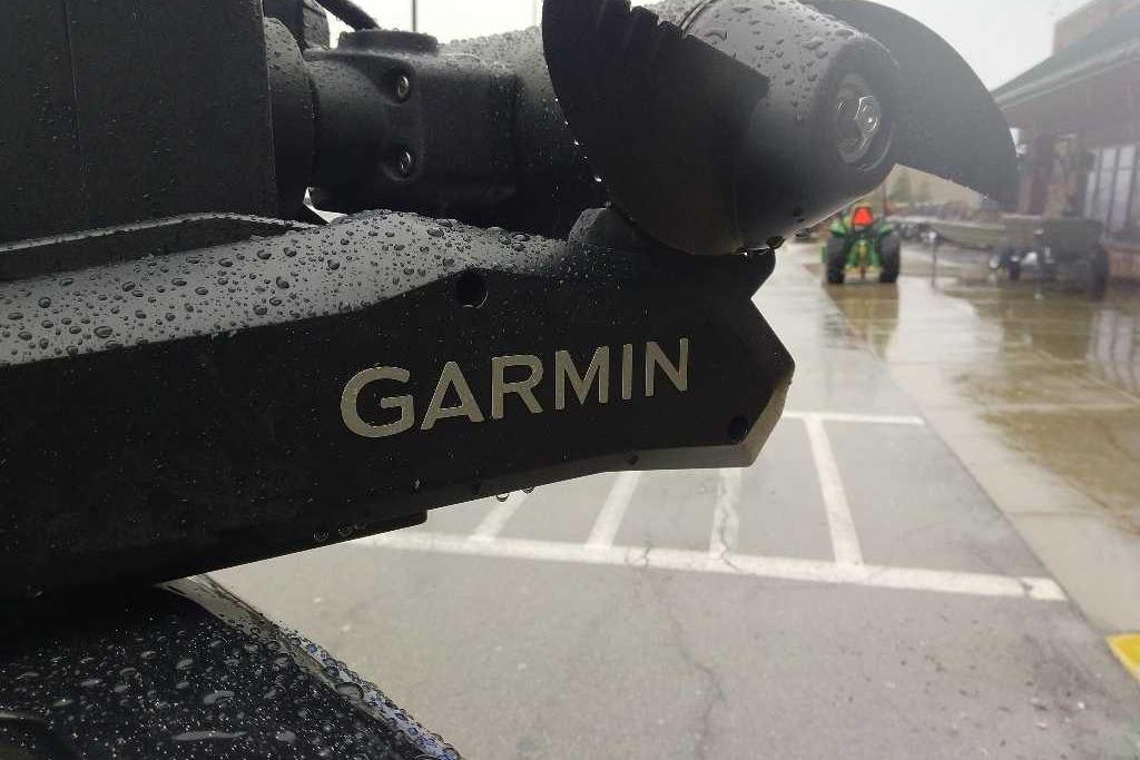 Close-up of Garmin device on 2026 Nitro ZV19 Sport Pro in rainy parking lot.