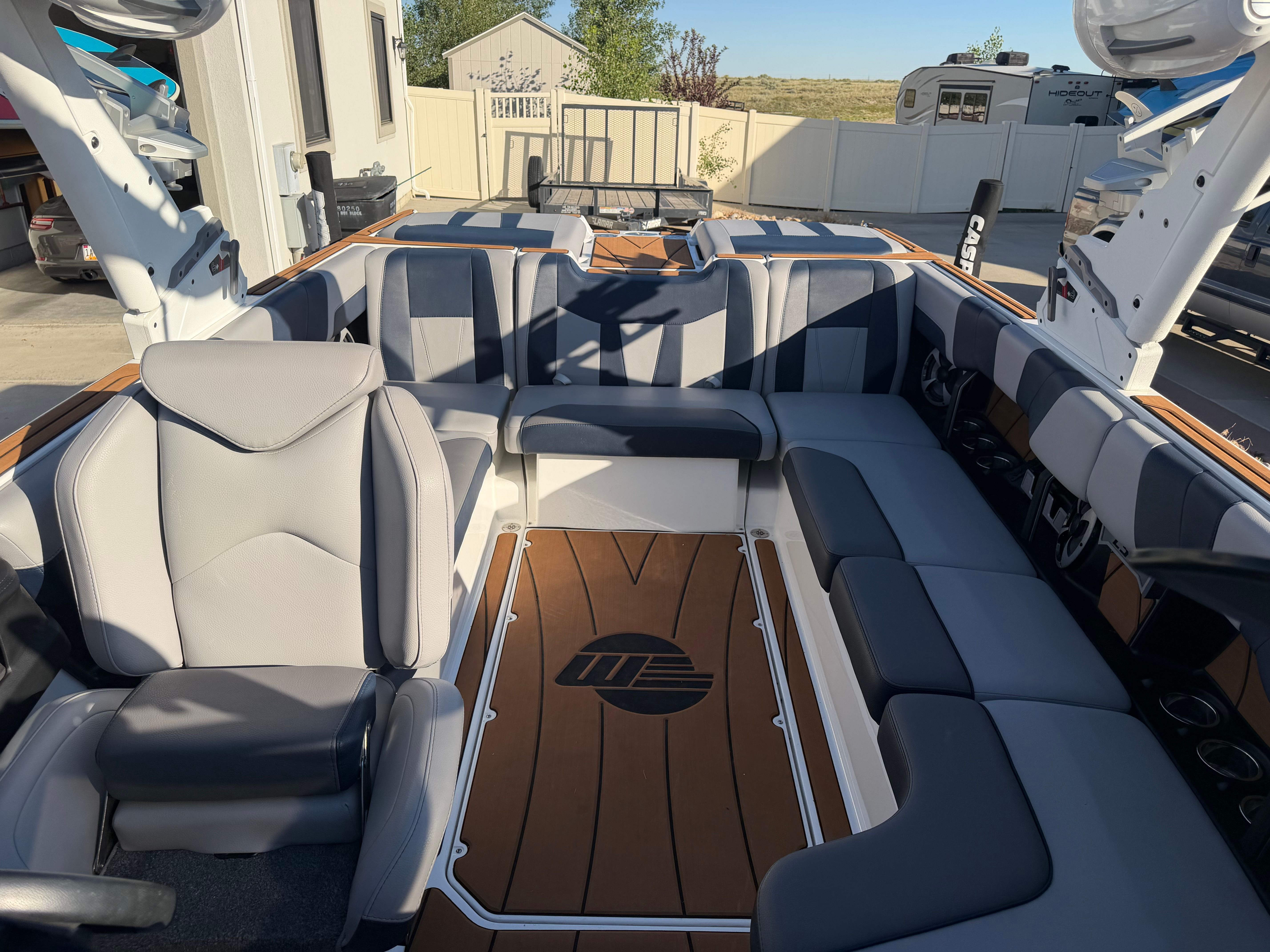 Interior of a 2021 Malibu Wakesetter 23 LSV with gray and black seating.