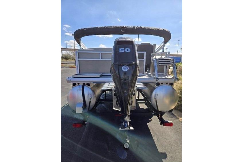 2026 Sun Tracker Bass Buggy 16 XL Select pontoon boat with 50 HP motor, rear view.