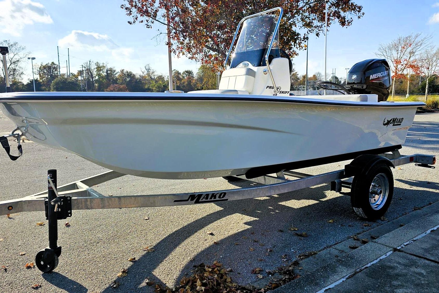 2026 Mako Pro Skiff 13 CC boat on trailer, parked outdoors, sunny day.