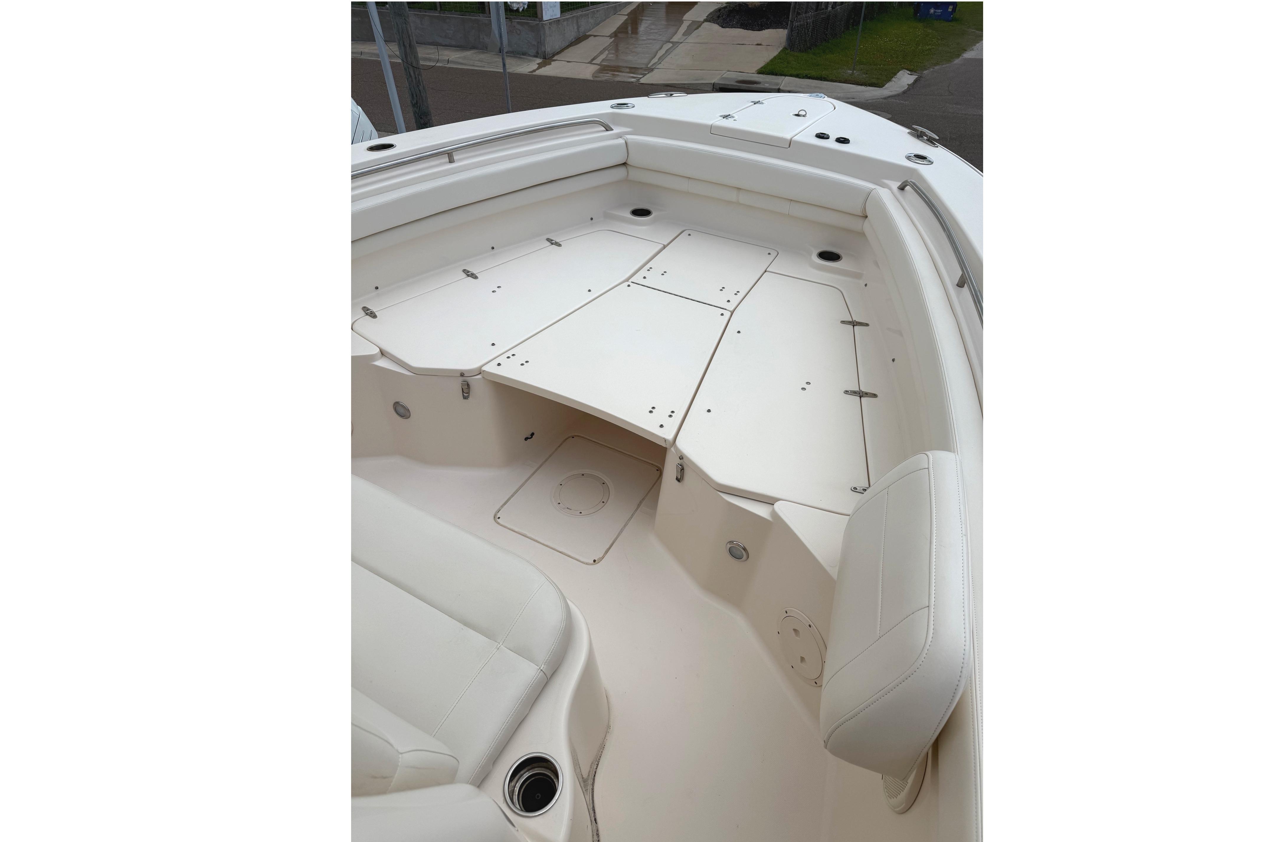 2018 Grady-White Canyon 306 boat interior with white seating and storage compartments.