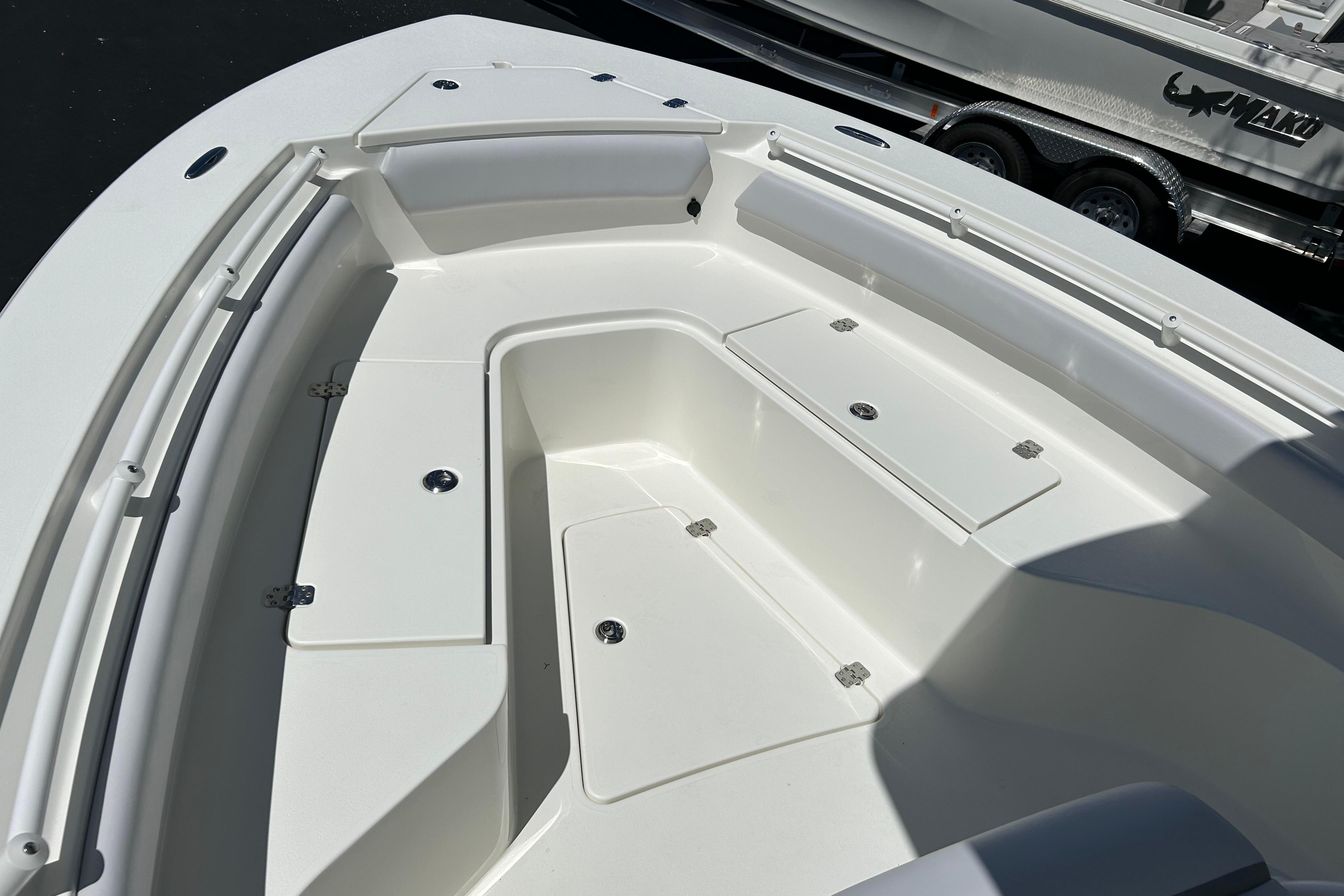 2026 Mako 226 Center Console boat interior with storage compartments and sleek design.