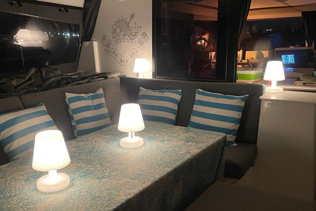Interior of 2020 Fountaine Pajot Saona 47 yacht with cozy seating and ambient lighting.