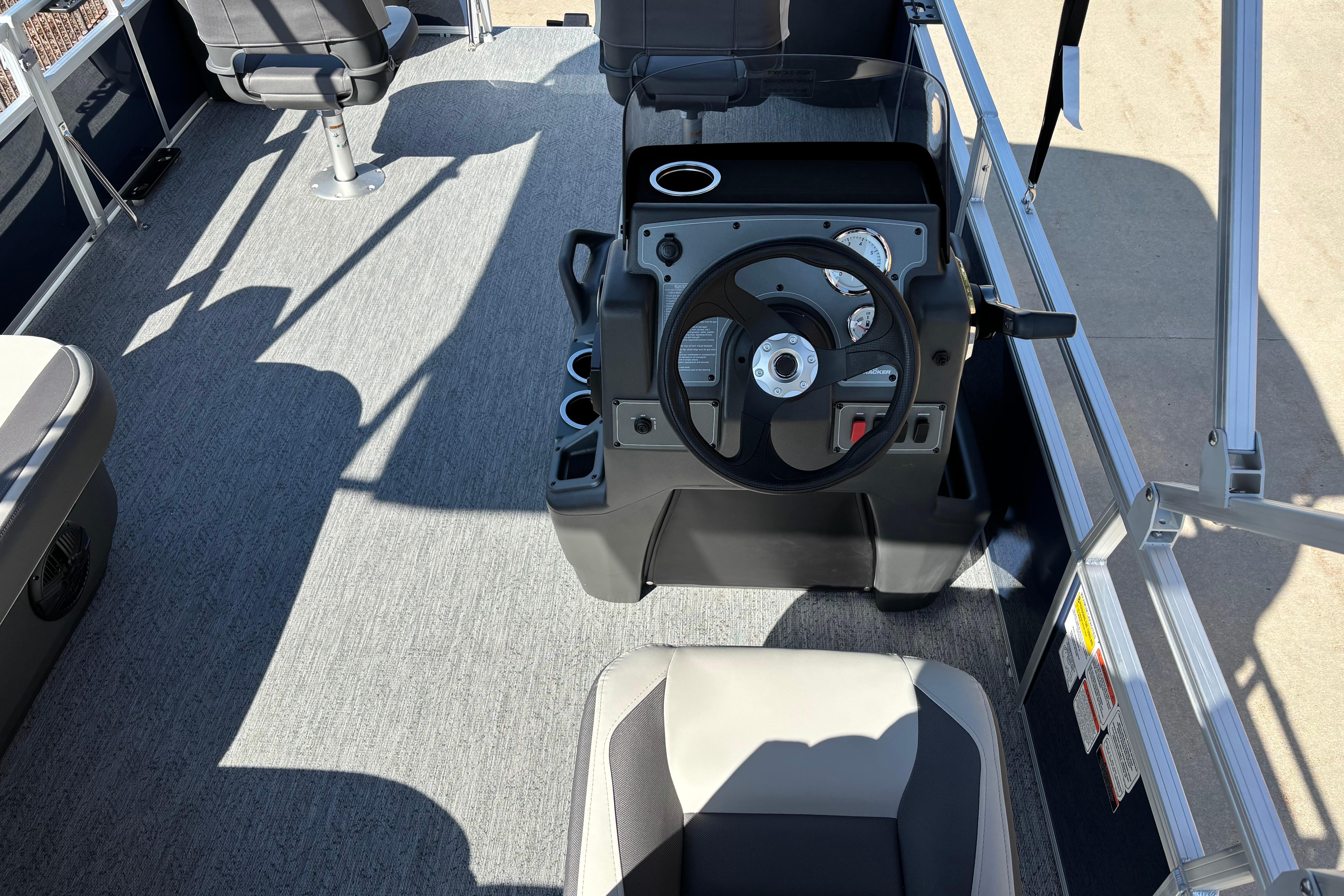 Interior view of 2026 Sun Tracker Bass Buggy 18 DLX pontoon boat cockpit.