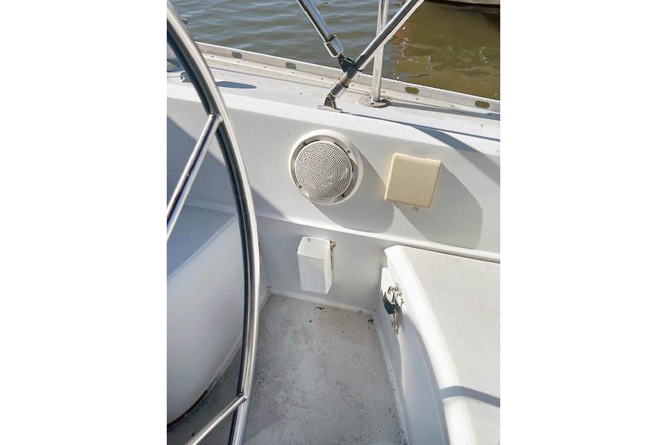 1988 O'Day 322 sailboat cockpit with steering wheel and speaker detail.