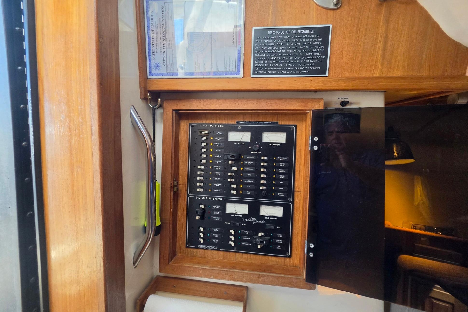 Electrical panel inside a 1999 Albemarle 305 Express Fisherman boat, featuring switches and controls.