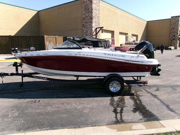 2024 Tahoe 200 S boat on trailer, parked outdoors near a building.