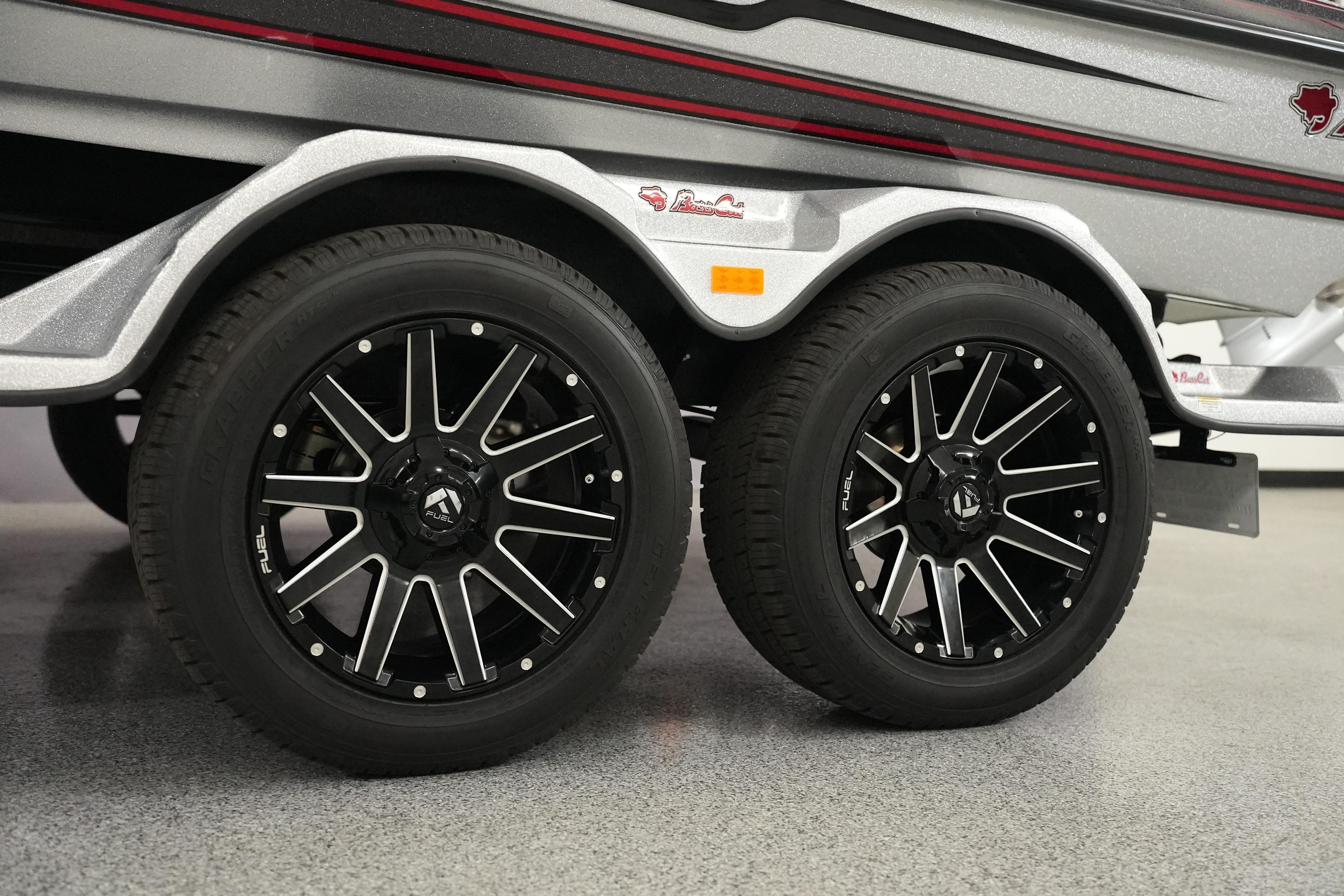 2026 Bass Cat Lynx STS trailer with stylish black alloy wheels.