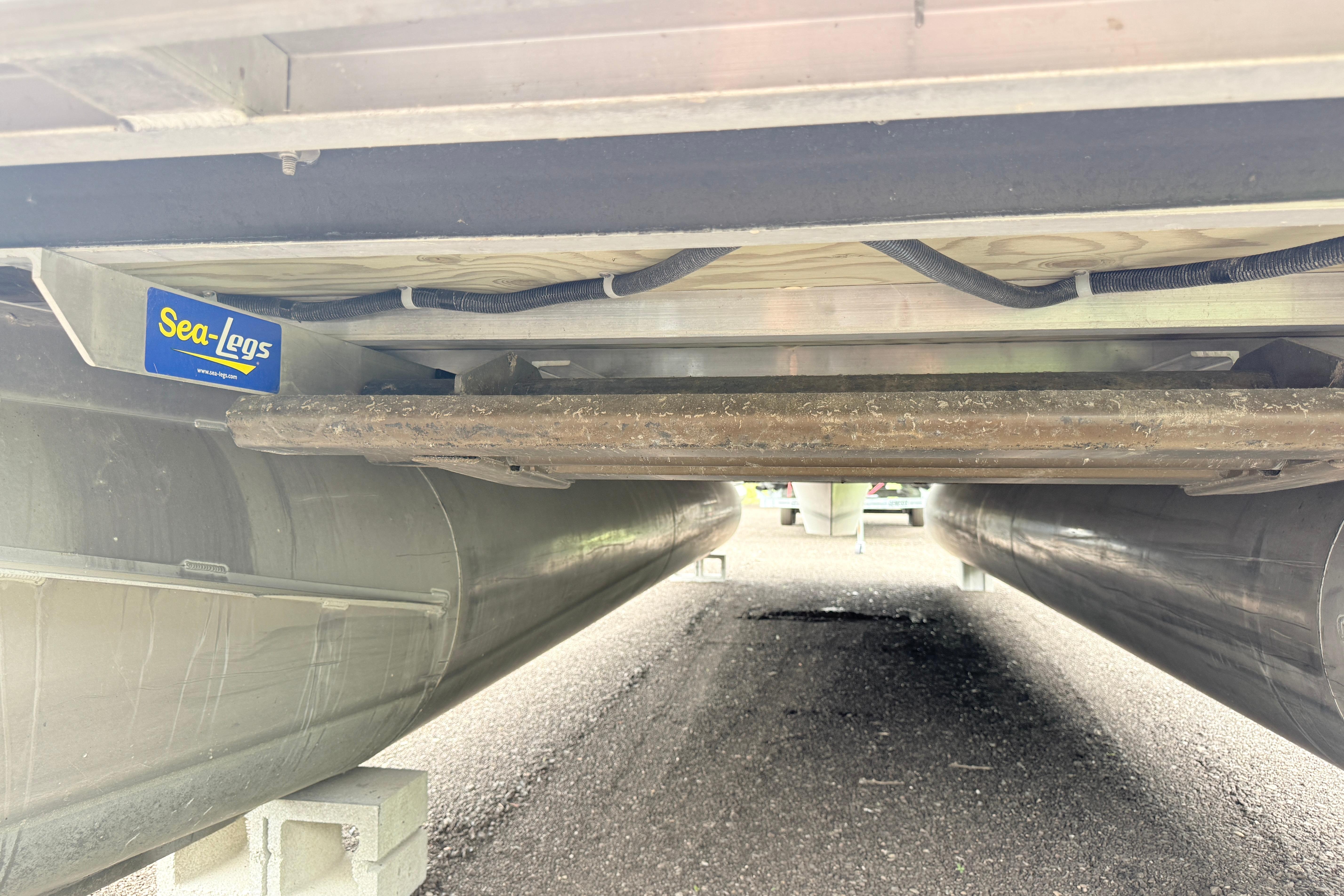 Underneath view of a 2013 South Bay 522CR pontoon boat with Sea-Legs system.