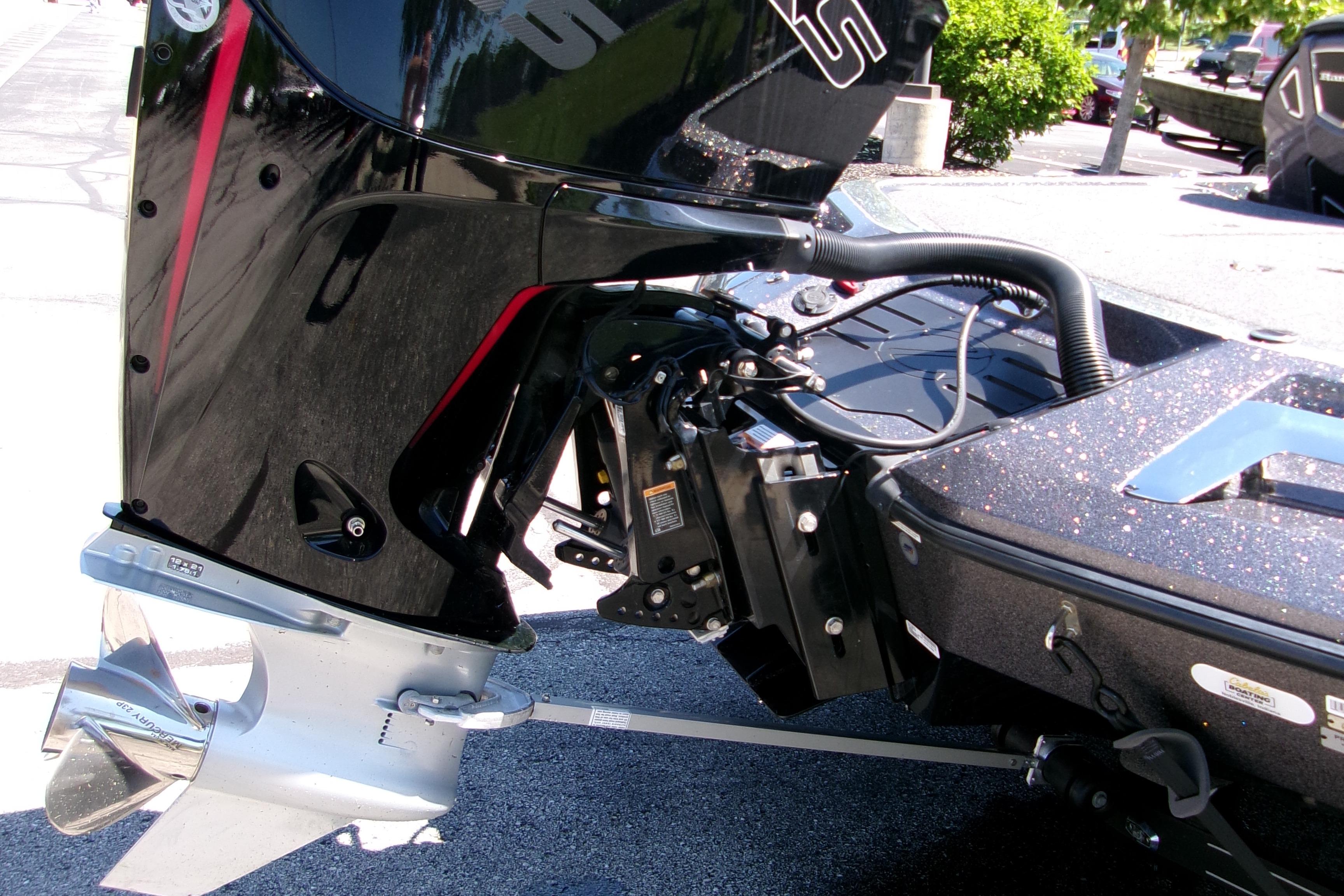 2025 Ranger Z519R Cup-Equipped boat engine close-up in a parking lot.