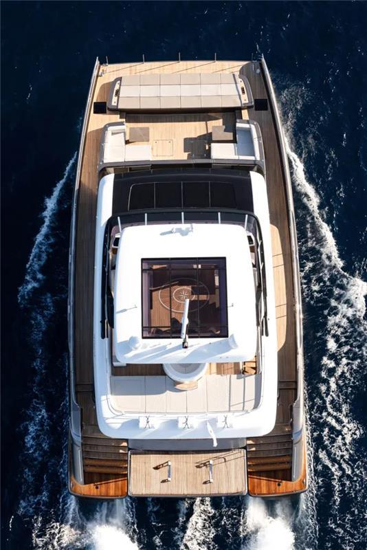 Aerial view of 2026 Sunreef 80 Sunreef Power yacht cruising on the ocean.