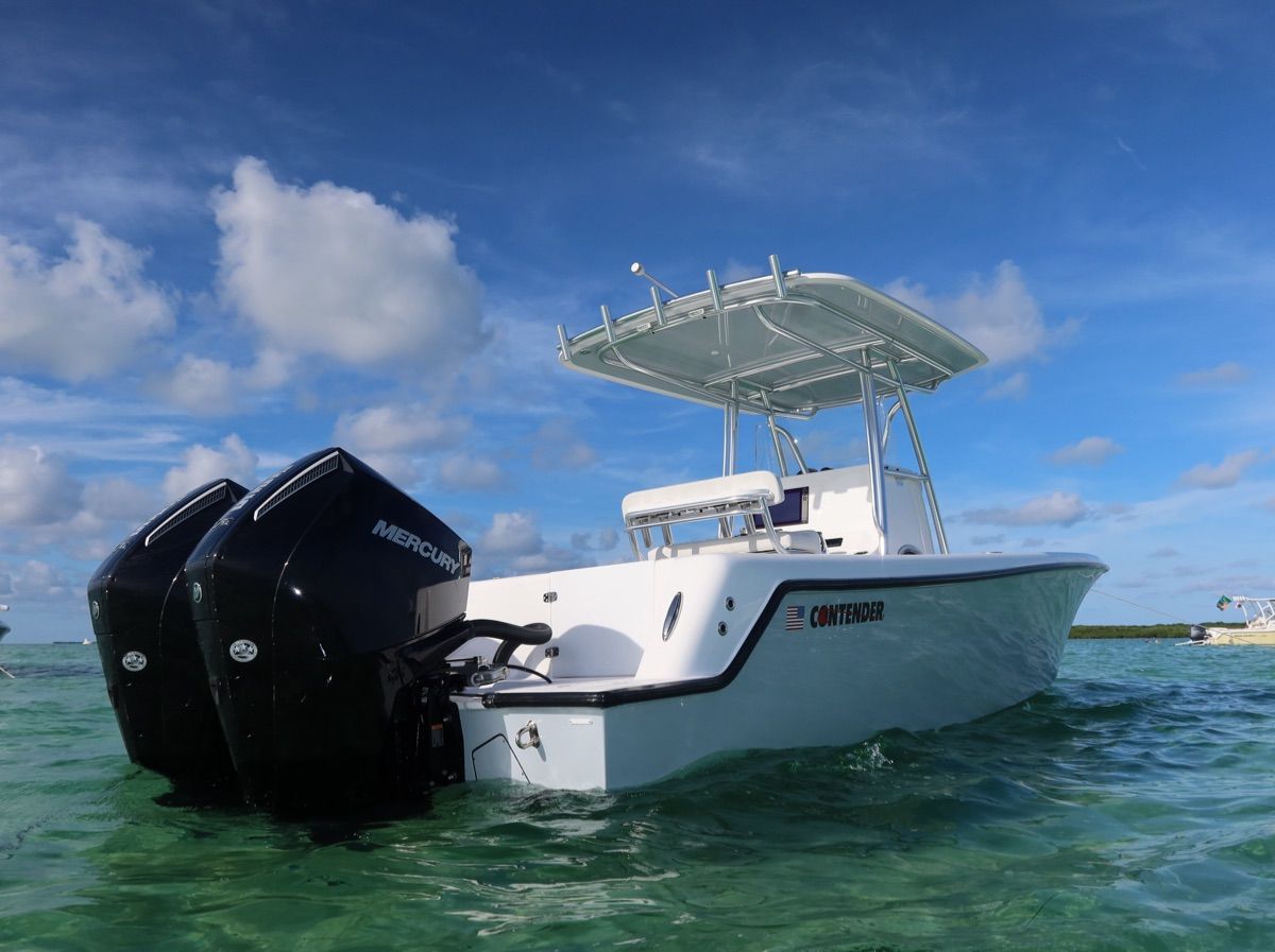 Contender 28 Tournament 2026 on clear water with twin outboard engines.