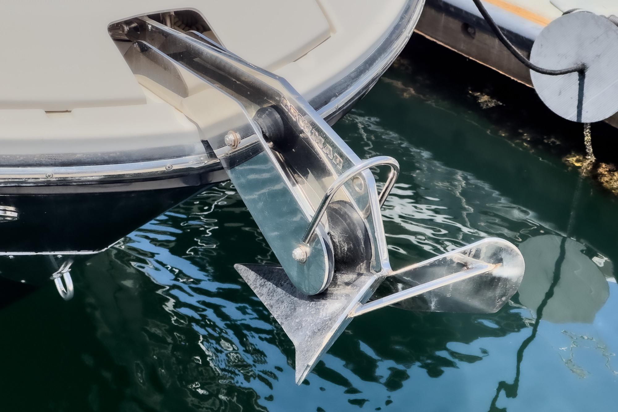 Anchor of 2018 Sea Ray SLX 310 boat in marina water.
