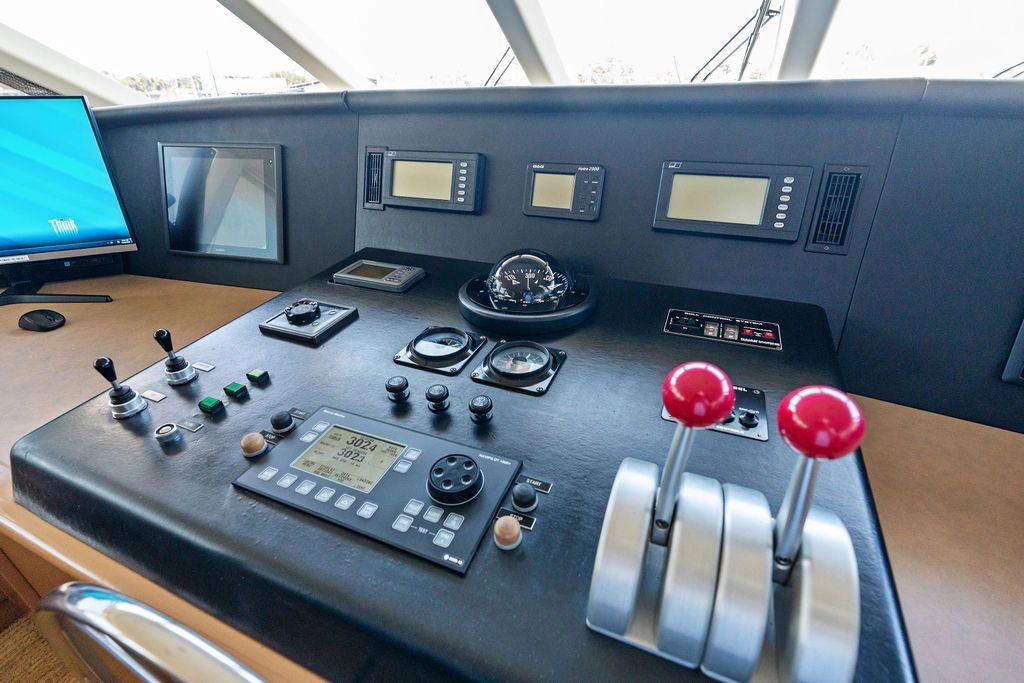 1999 Westport 112 yacht helm with modern navigation instruments.