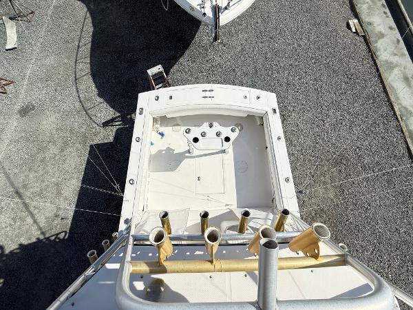 2001 Albemarle 280 Express Sport Fisherman boat, aerial view, docked on gravel.
