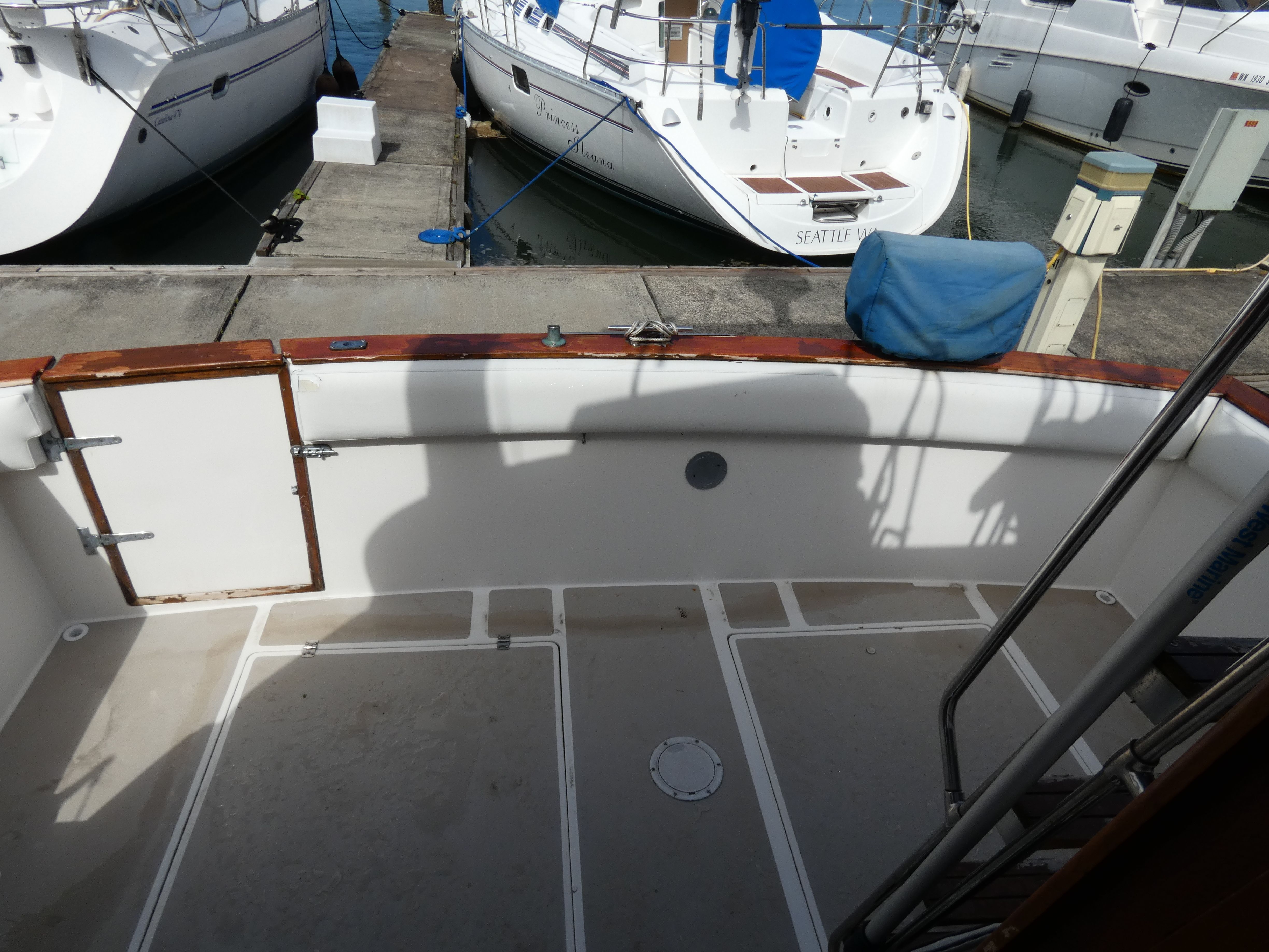 1984 Bayliner 3870 Motoryacht, open deck at dock.