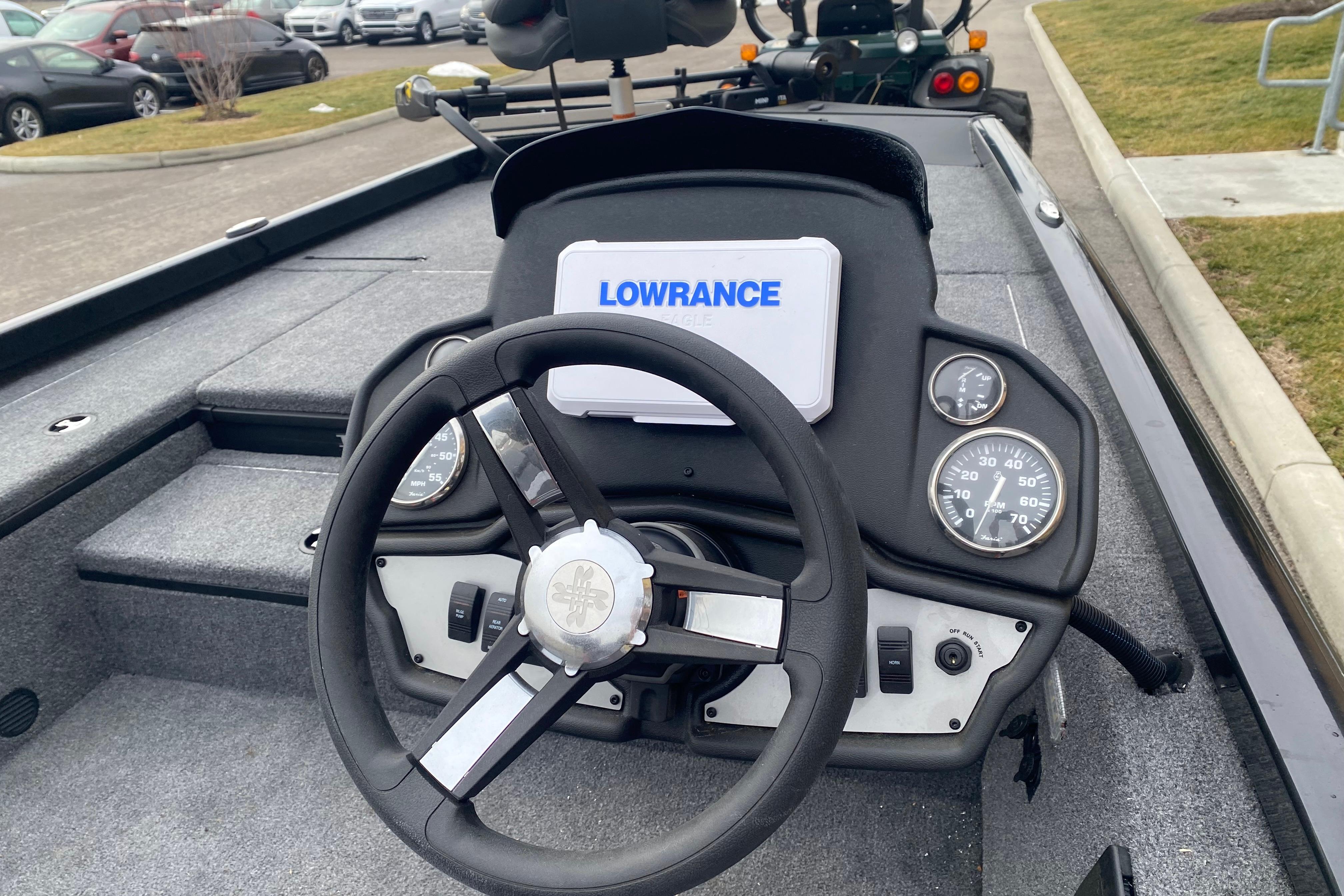 2025 Ranger RT178 boat dashboard with Lowrance display and steering wheel.