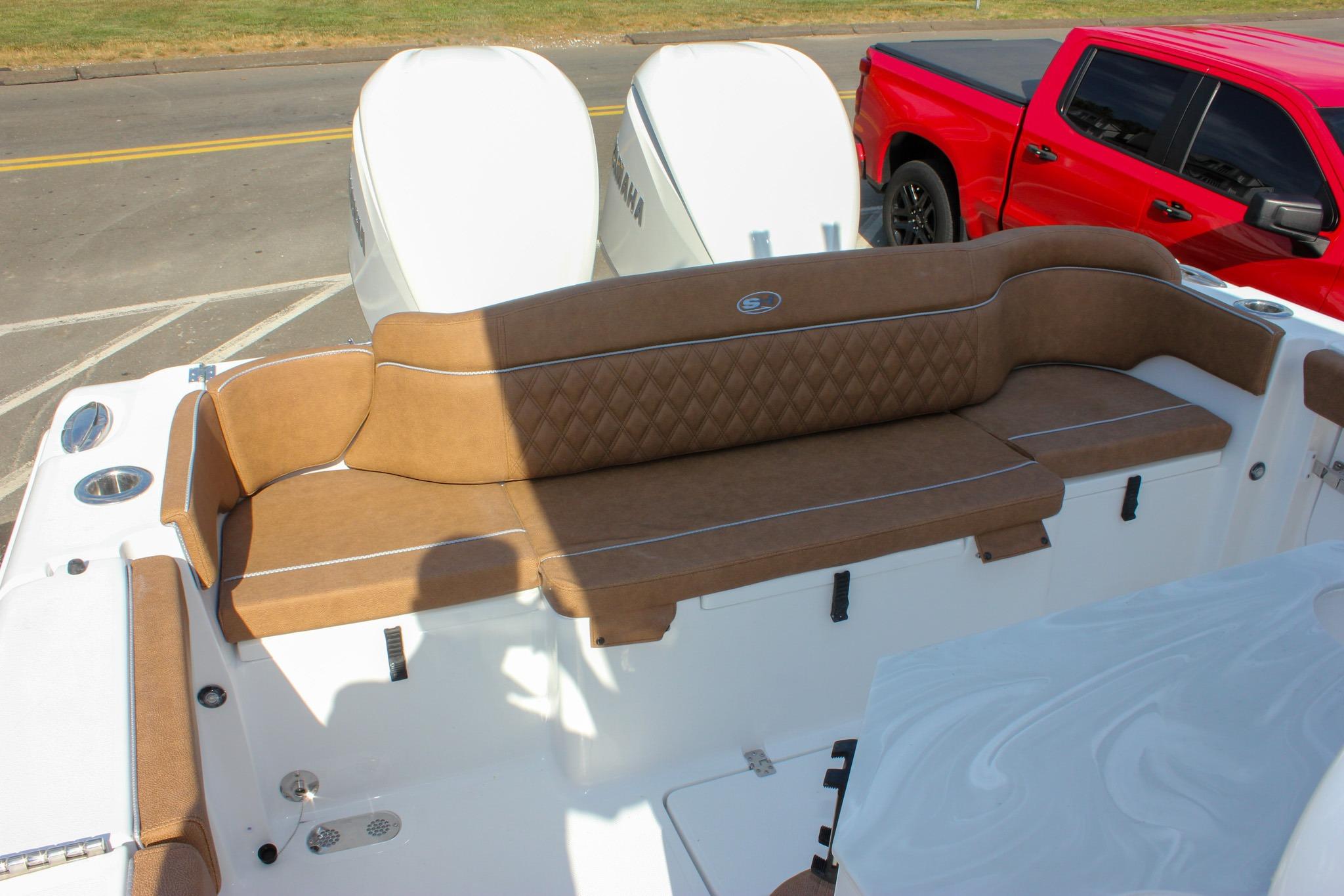 2027 Sea Hunt Ultra 275 SE boat with tan seating and dual Yamaha engines.
