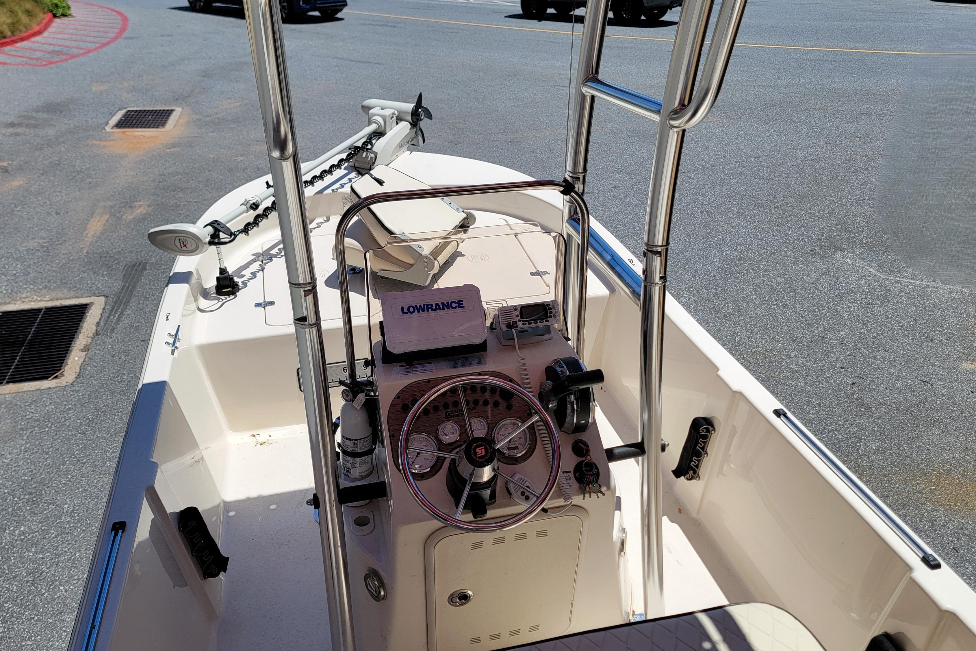 2021 Carolina Skiff 178 JLS boat interior with steering console and Lowrance equipment.