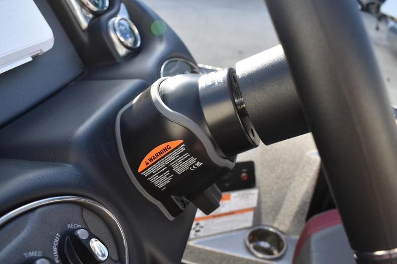 2026 Triton 179 TrX steering wheel with warning label, close-up view.