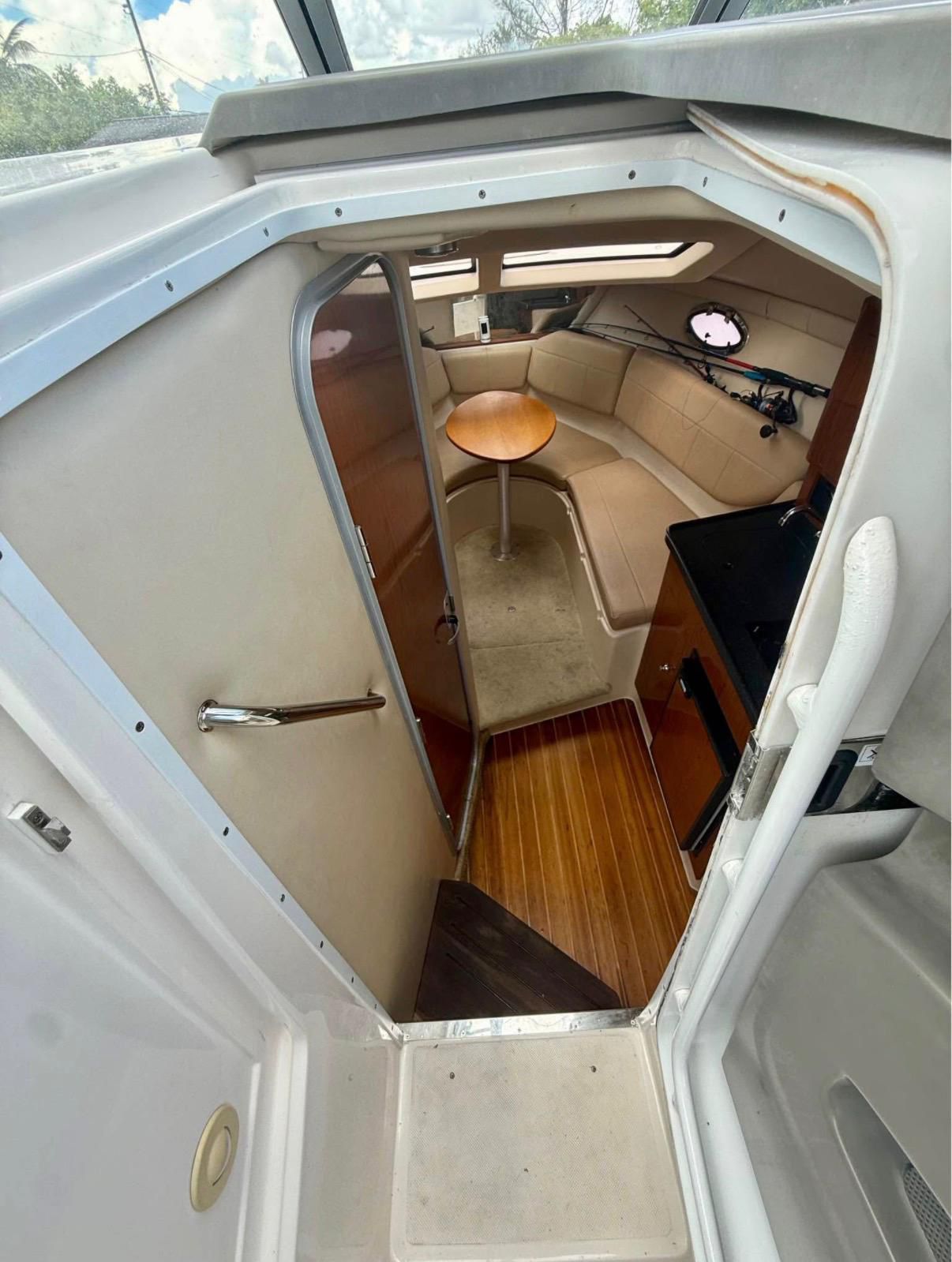 Interior of a 2008 Regal 2565 Window Express with seating area and table.