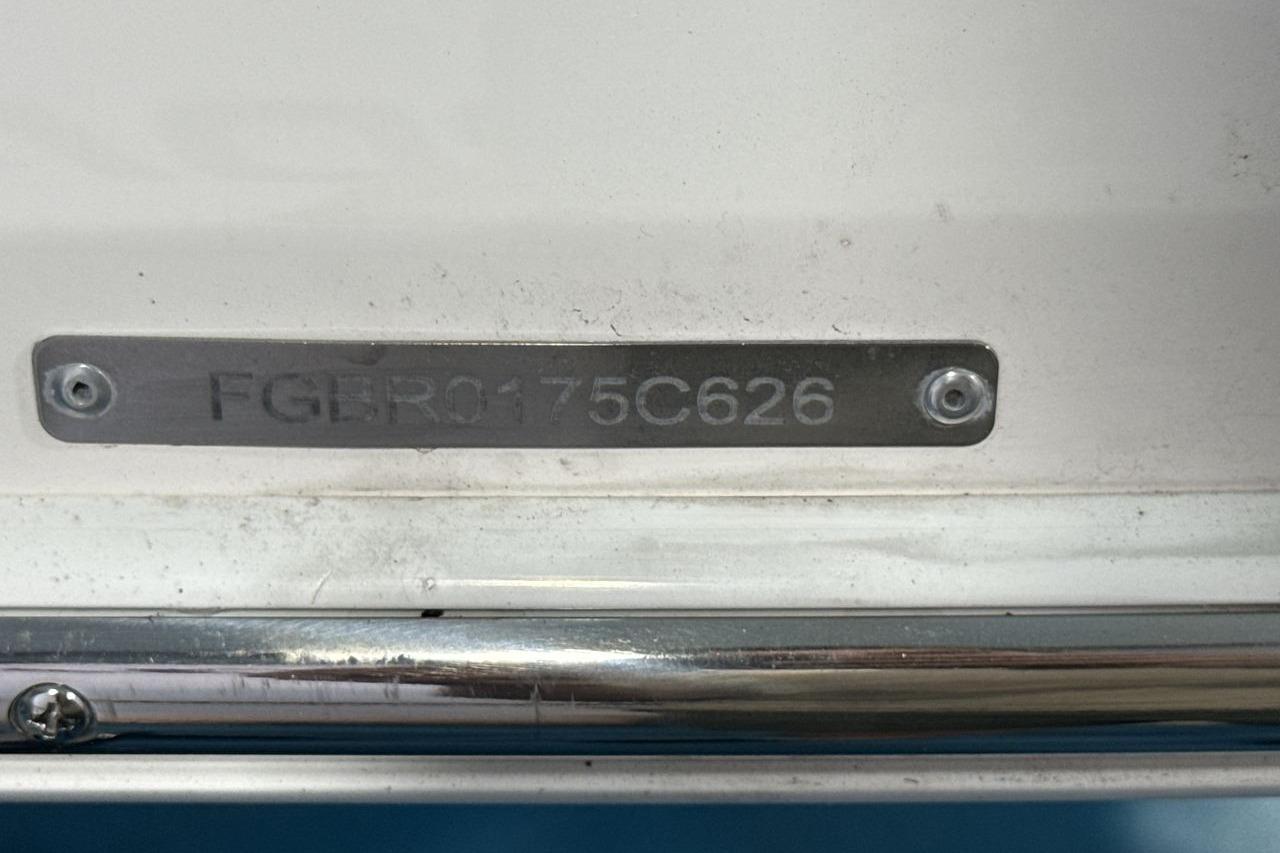 Close-up of a serial number on a boat.