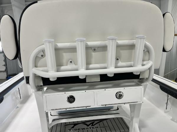 2025 Tidewater 2300 Carolina Bay boat with rod holders and storage drawers.