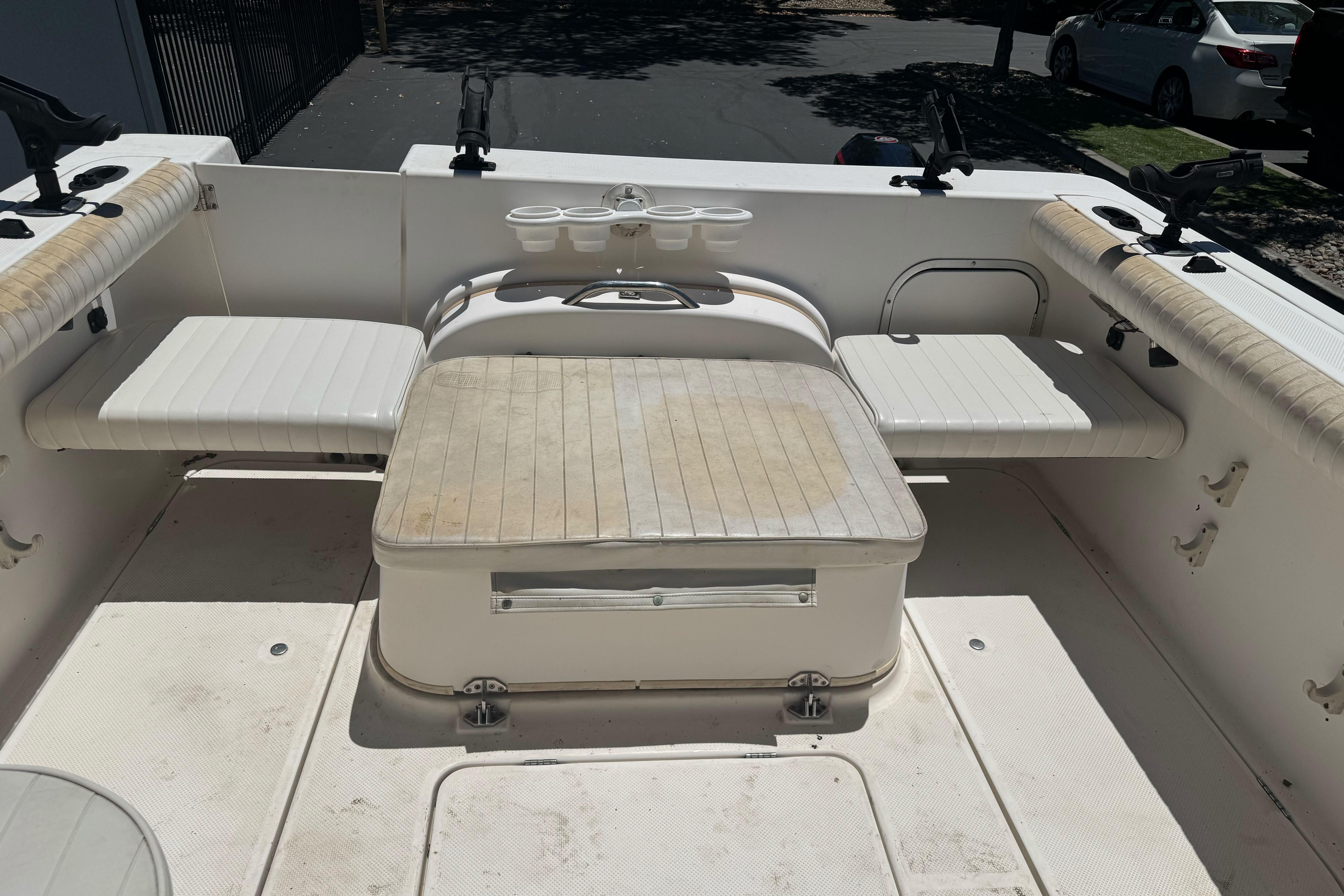 2004 Trophy 2359 WA boat interior with seating and rod holders.
