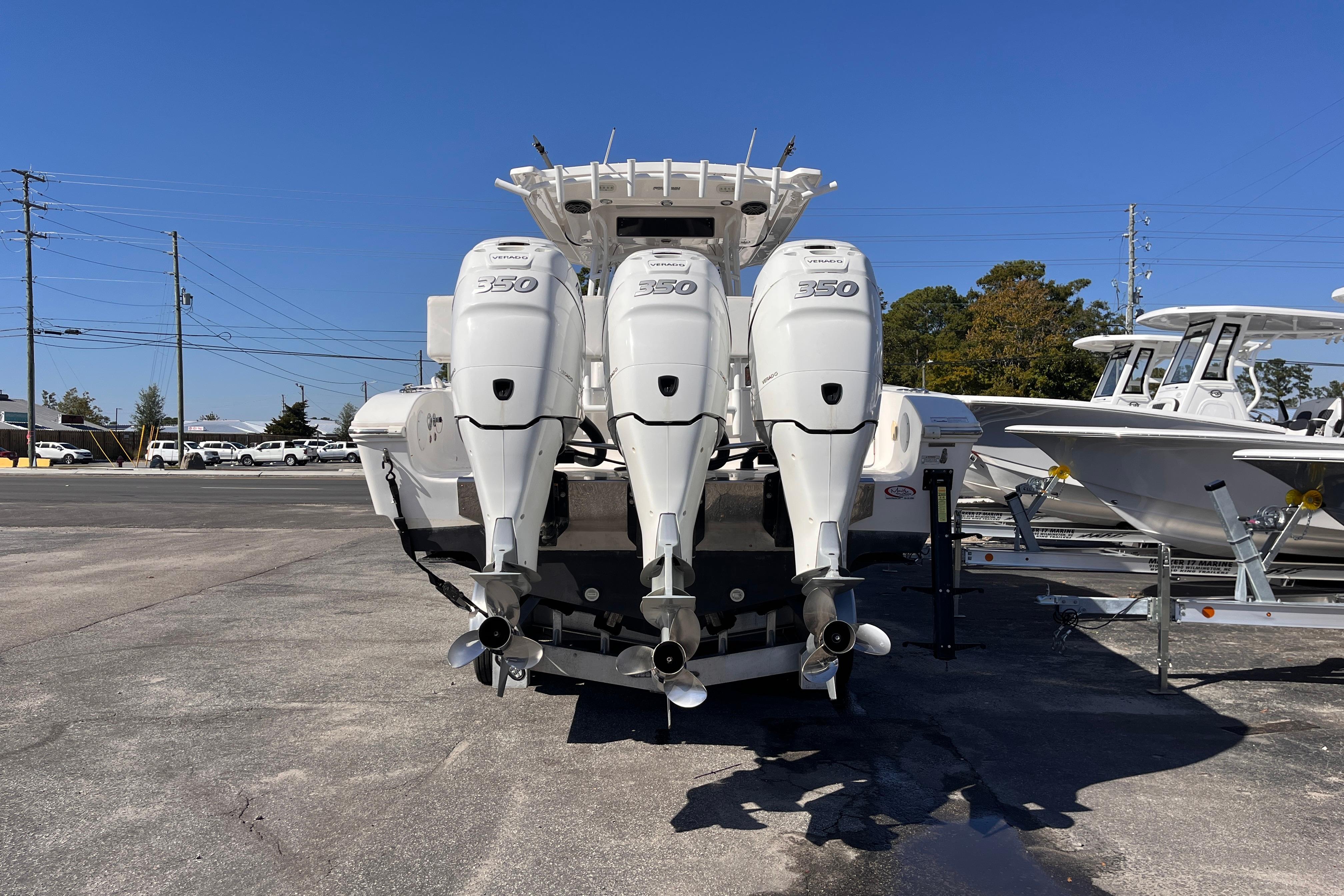 2019 Fountain 38 Center Console with triple 350 horsepower engines, parked outdoors.