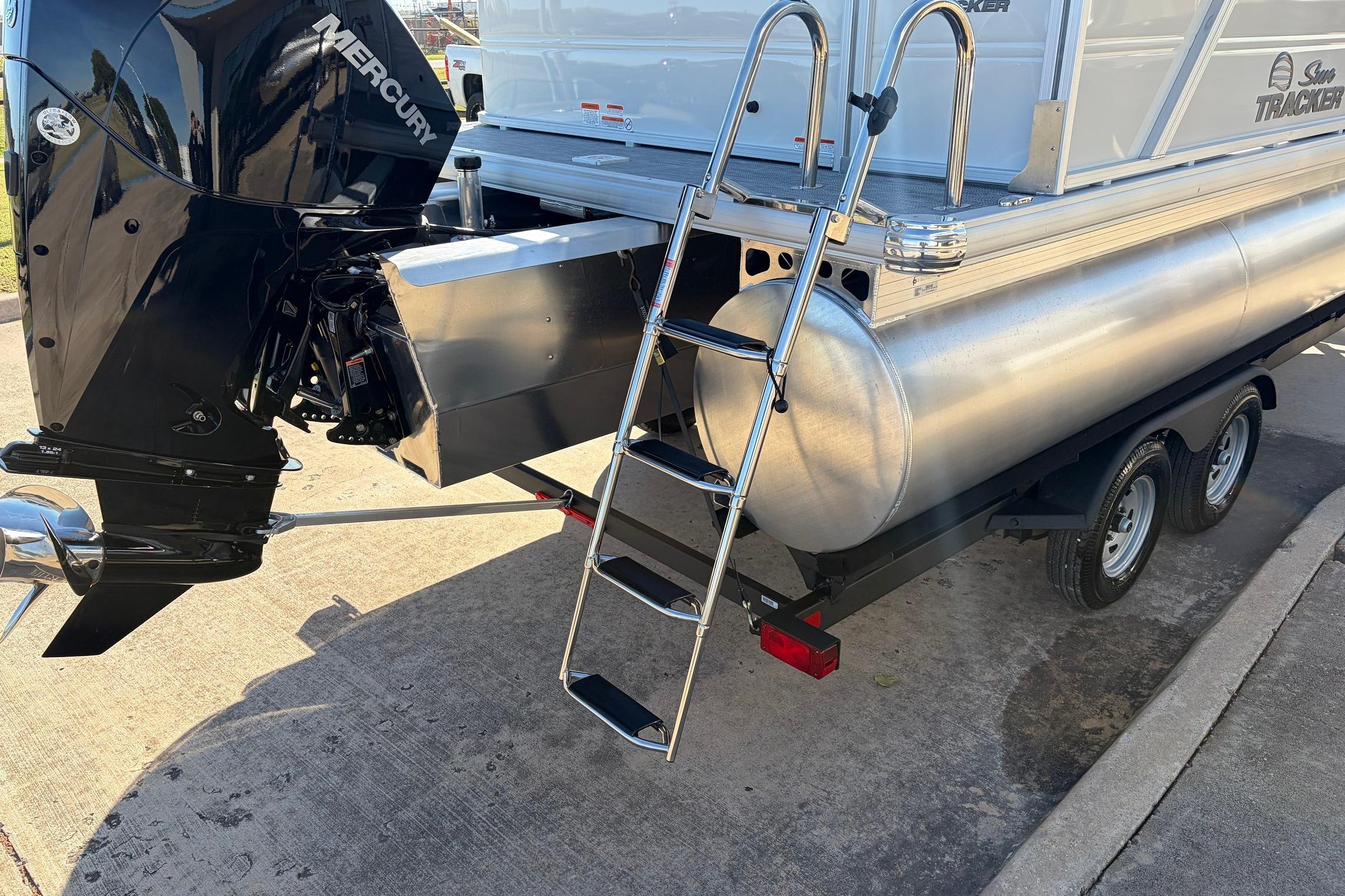 2026 Sun Tracker Party Barge 22 RF XP3 with Mercury engine and ladder on trailer.