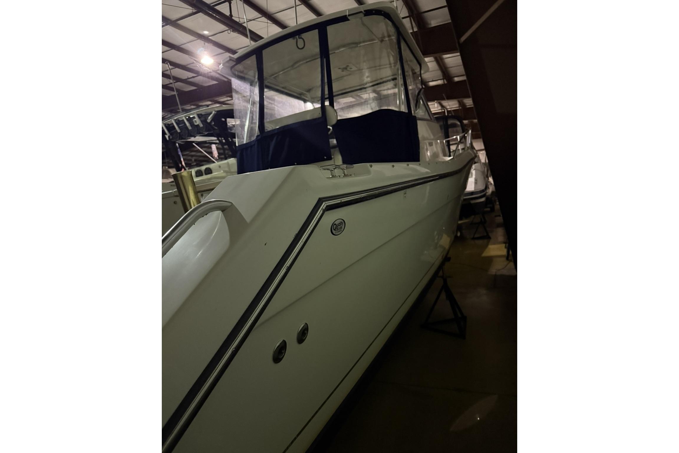 2000 Pursuit 3070 Offshore Center Console boat in indoor storage.