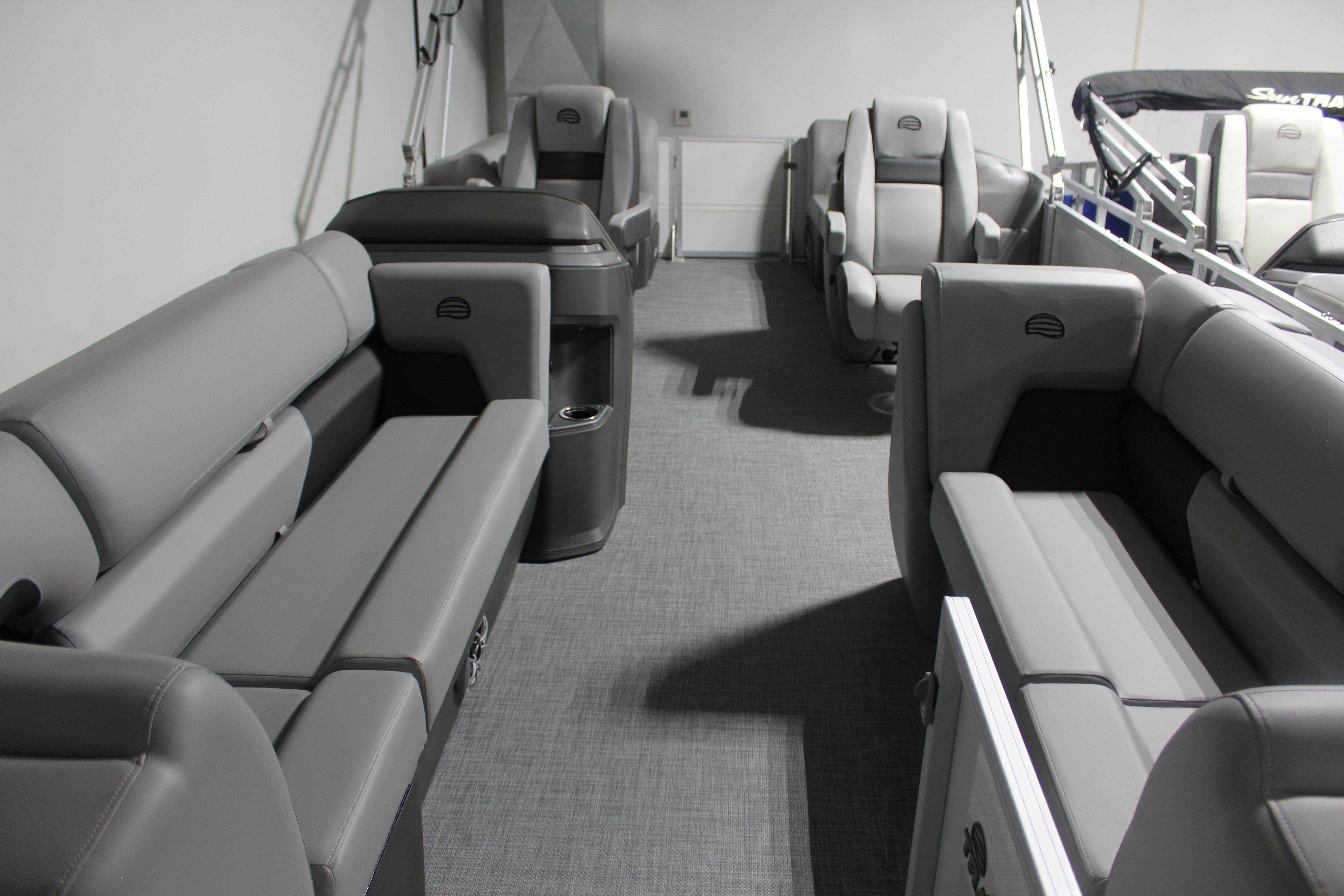 2026 Sun Tracker Party Barge 22 DLX interior with spacious gray seating and modern design.