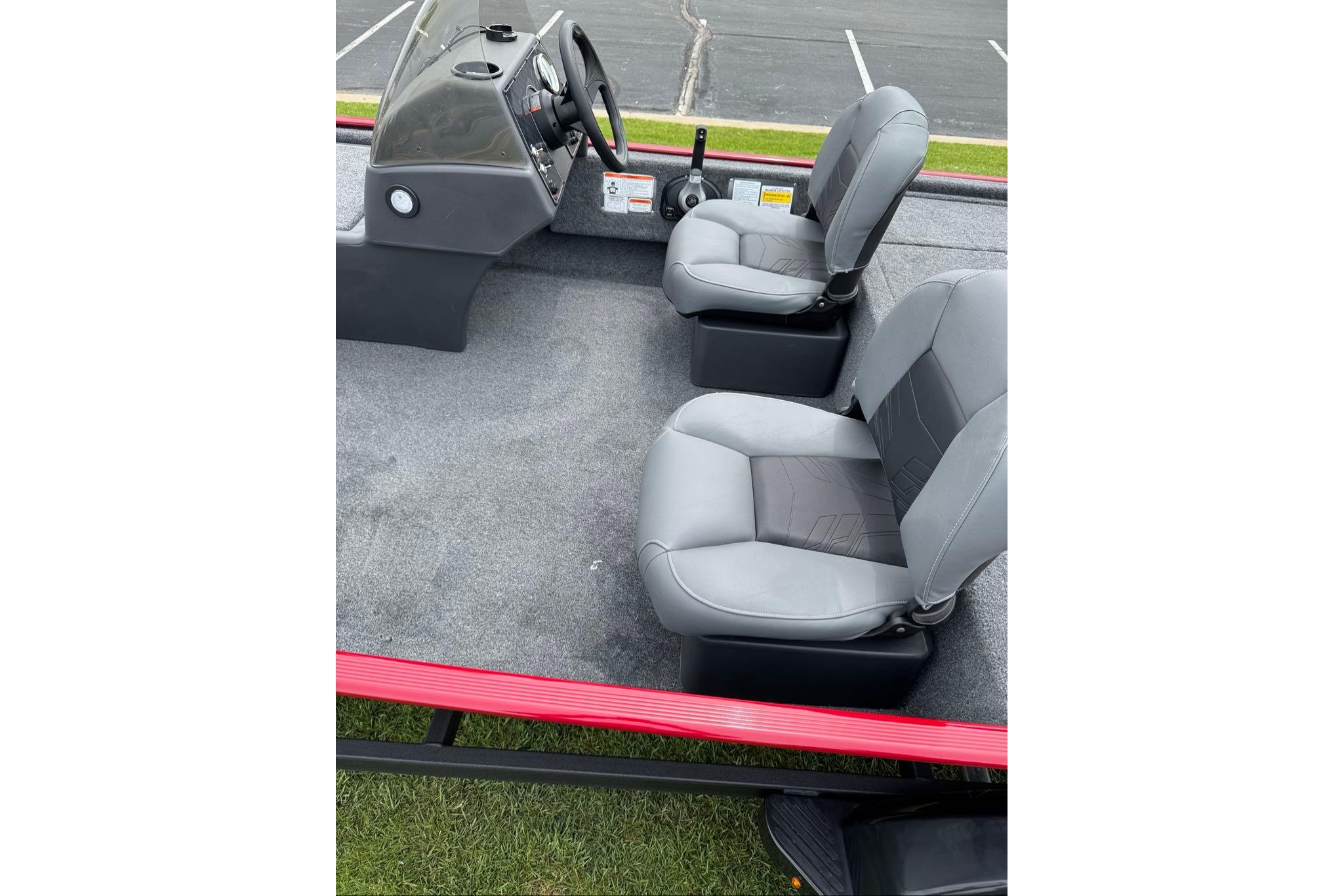2026 Tracker Bass Tracker Classic XL boat interior with two gray seats and steering console.