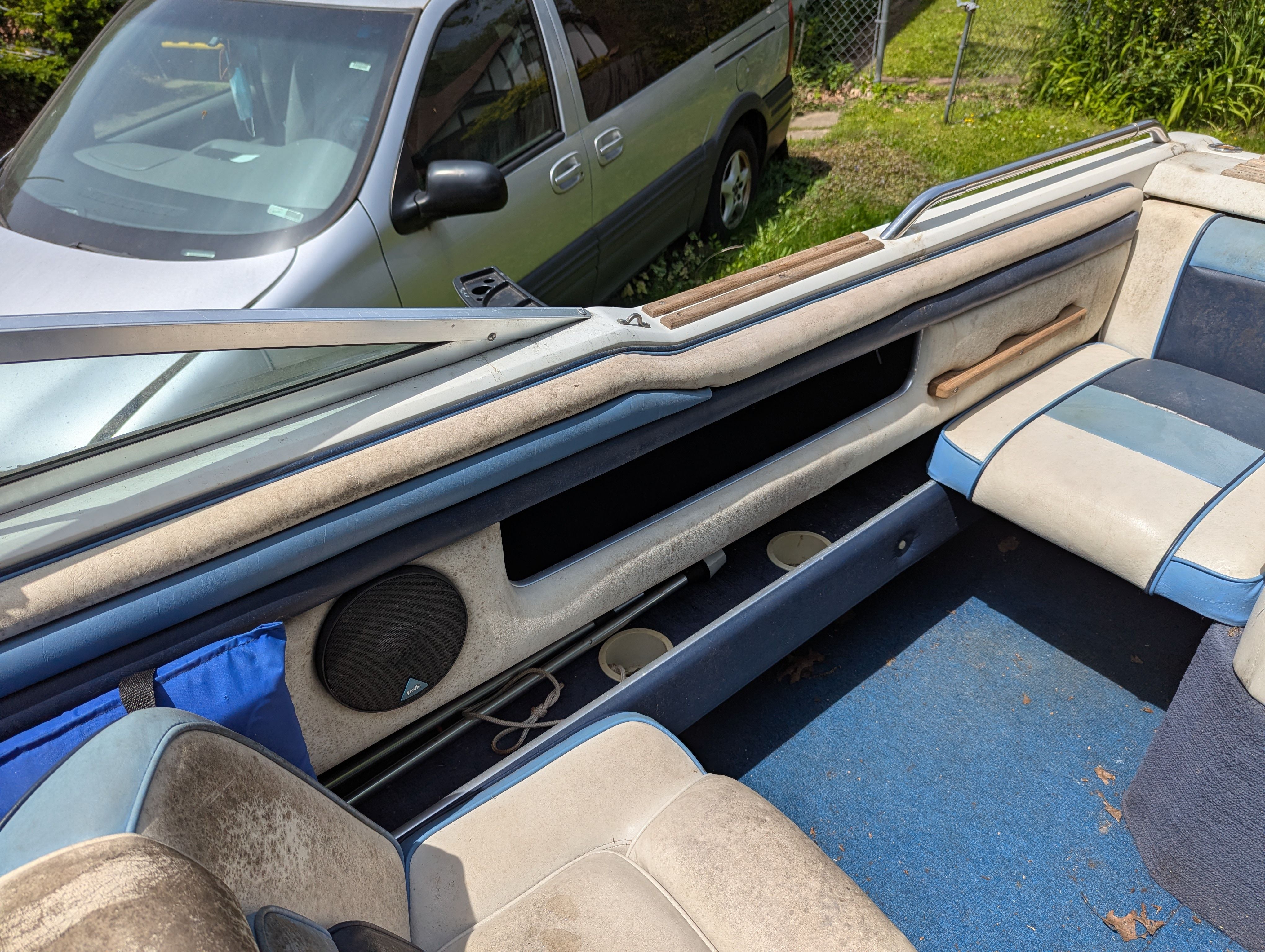 Interior of a 1988 Four Winns 200 Horizon boat with blue seating.