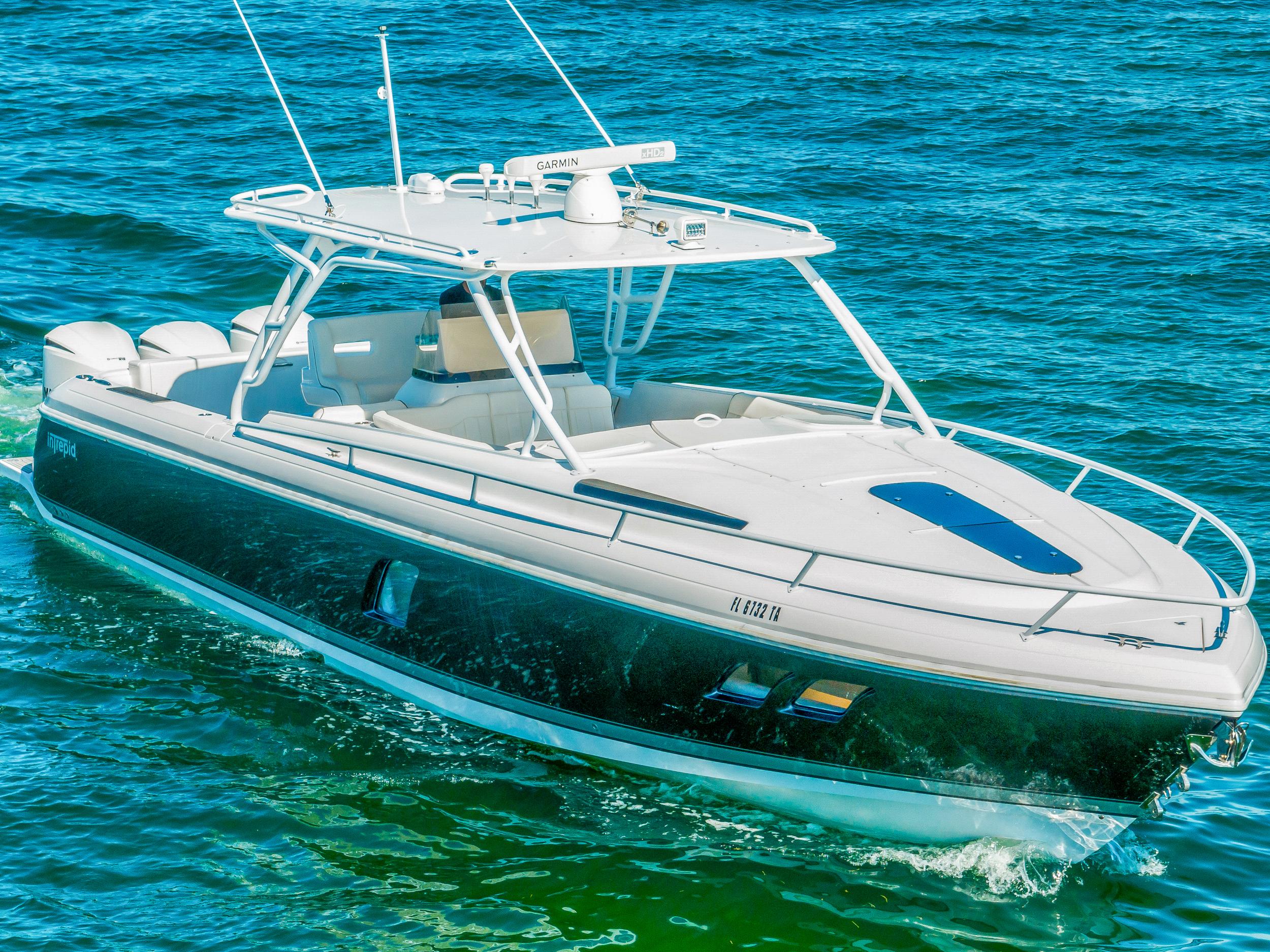 2016 Intrepid 400 Cuddy boat cruising on blue water.
