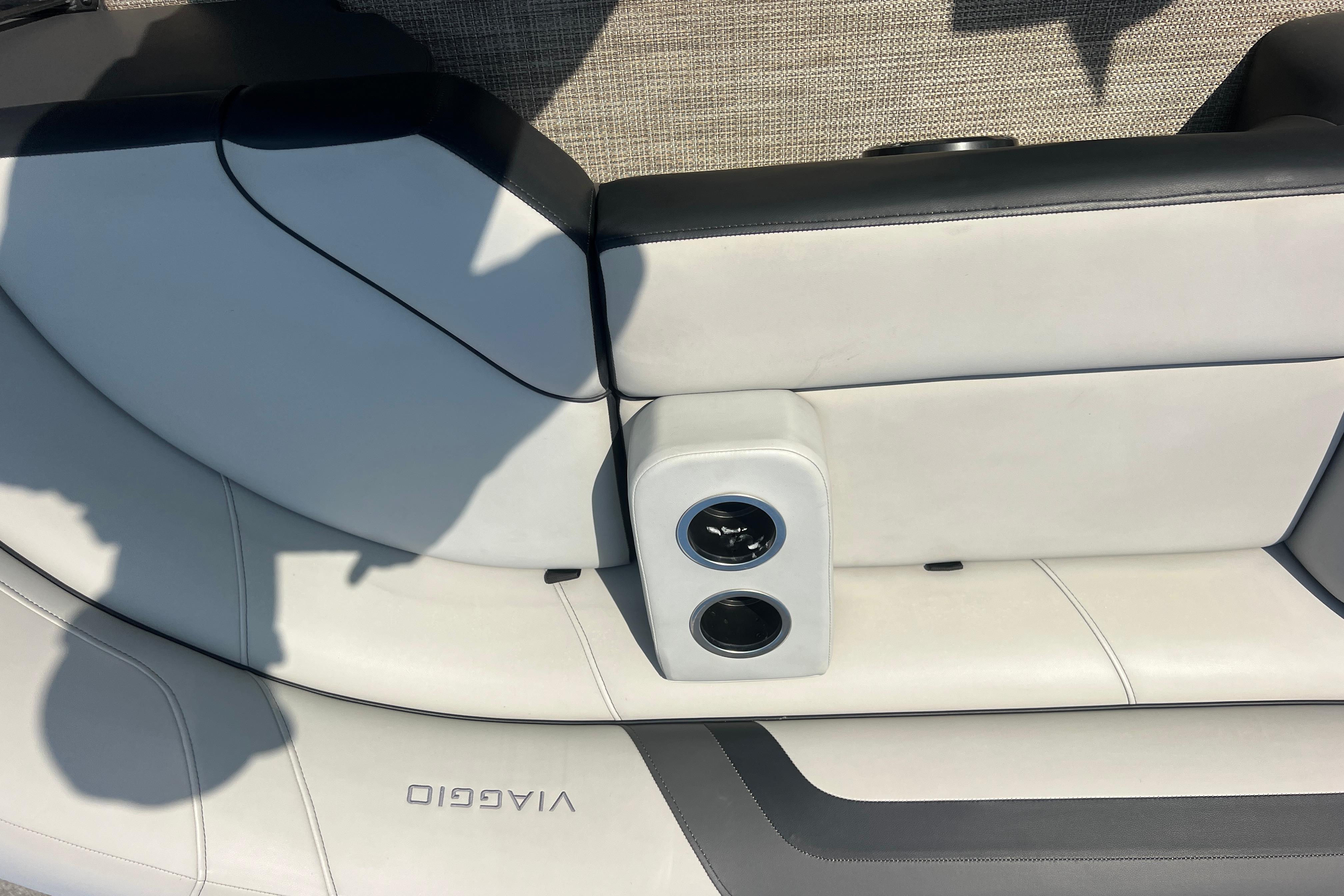 Viaggio Lago V-U 22 boat interior, featuring sleek white and black seating, 2022 model.