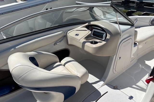 2012 Tahoe Q8 SSi boat interior with steering console and cushioned seating.