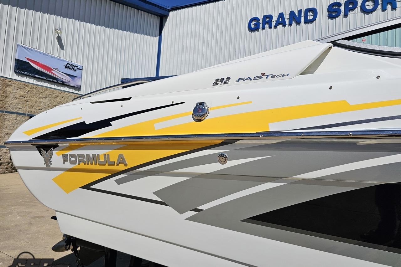 2014 Formula 292 FASTech boat with sleek yellow and gray graphics at Grand Sport Center.