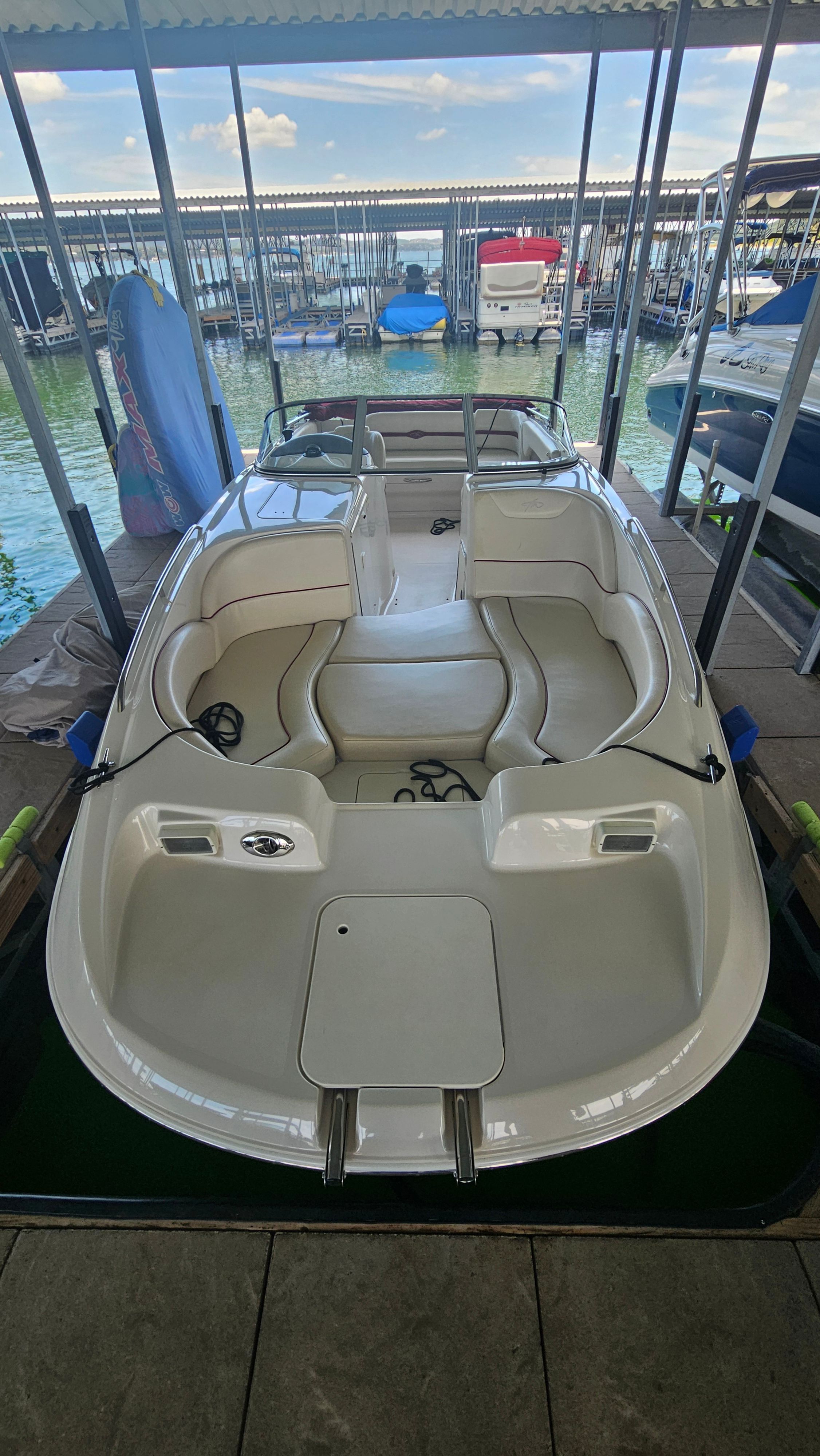 2002 Monterey 220 Explorer Sport in a covered dock.