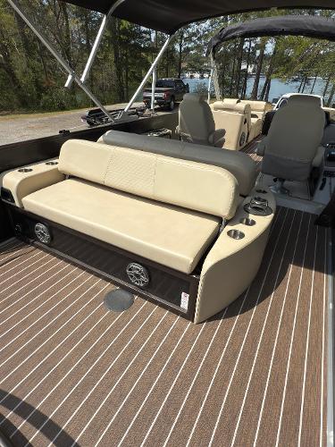 2022 Premier 250 Solaris boat interior with beige seating and striped flooring.