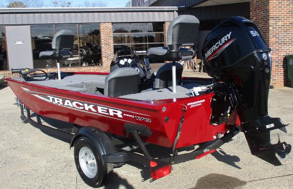 2025 Tracker Pro 170 boat with Mercury engine, parked outdoors.