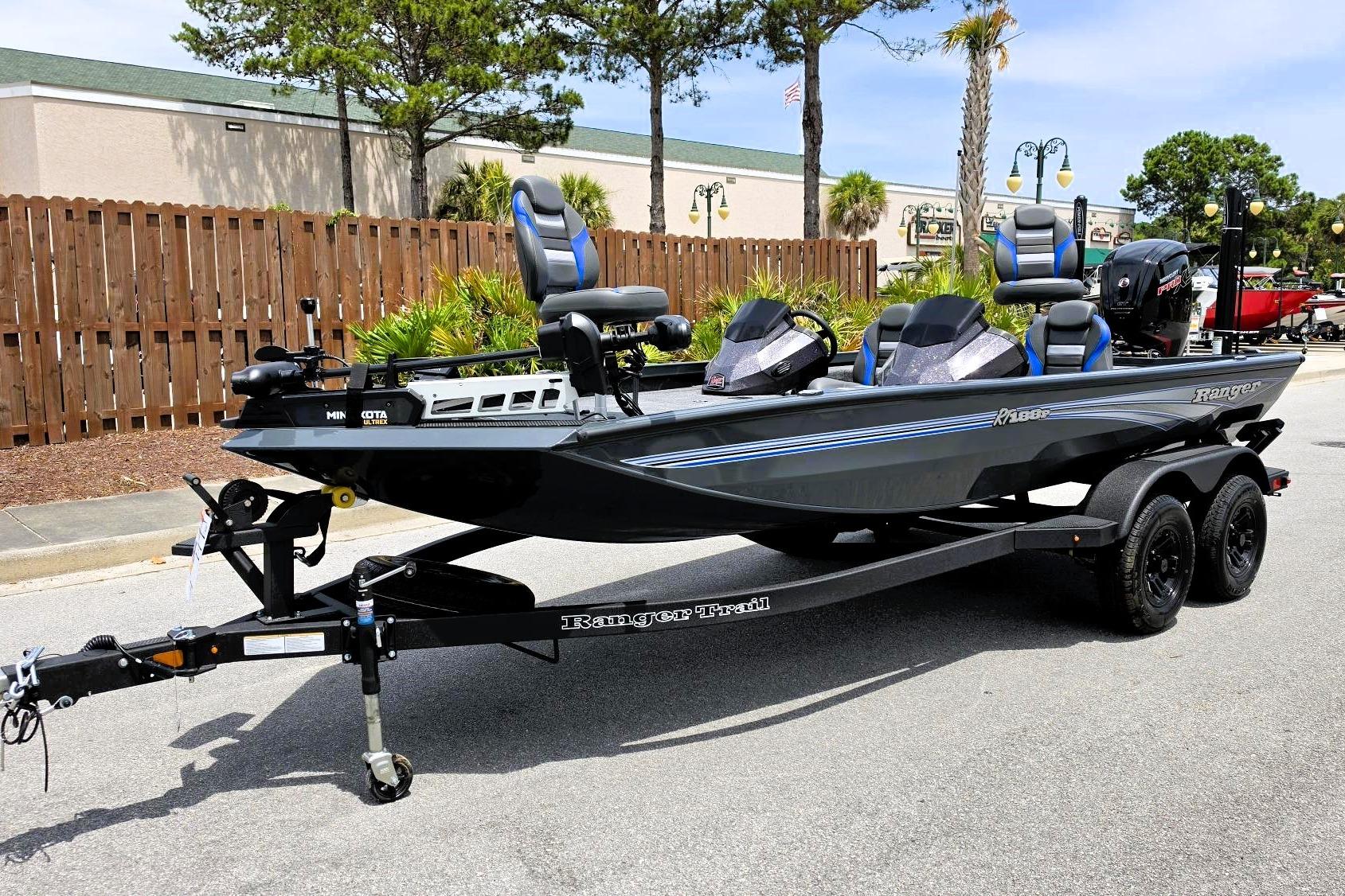 2026 Ranger RT188P fishing boat on trailer, parked outdoors, featuring sleek design and modern equipment.