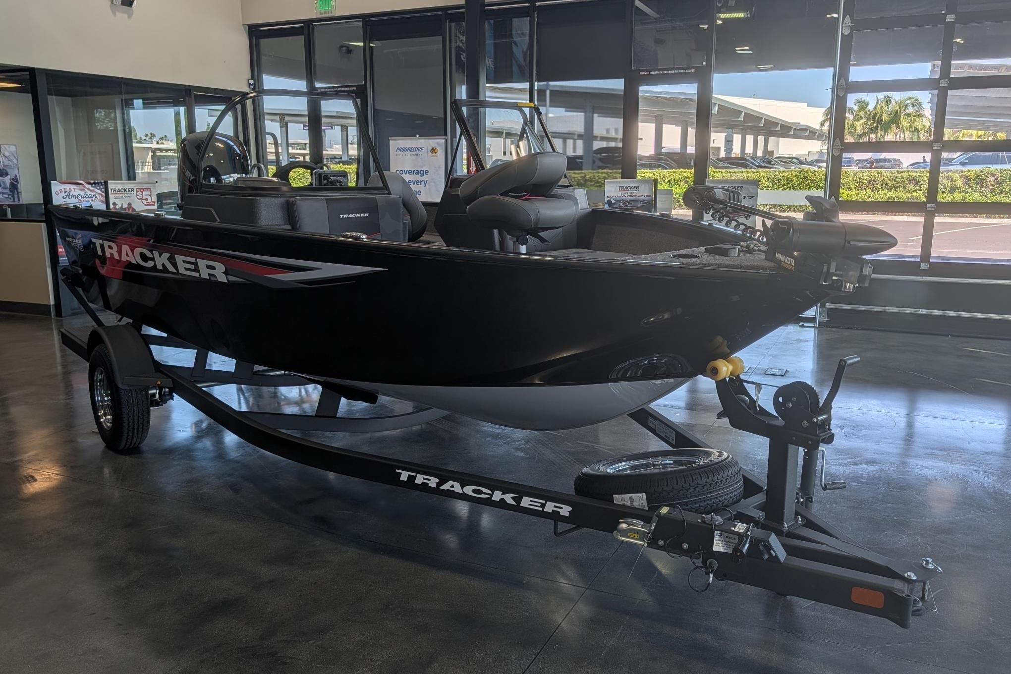 2026 Tracker Pro Guide V-175 Combo boat displayed indoors on a trailer.