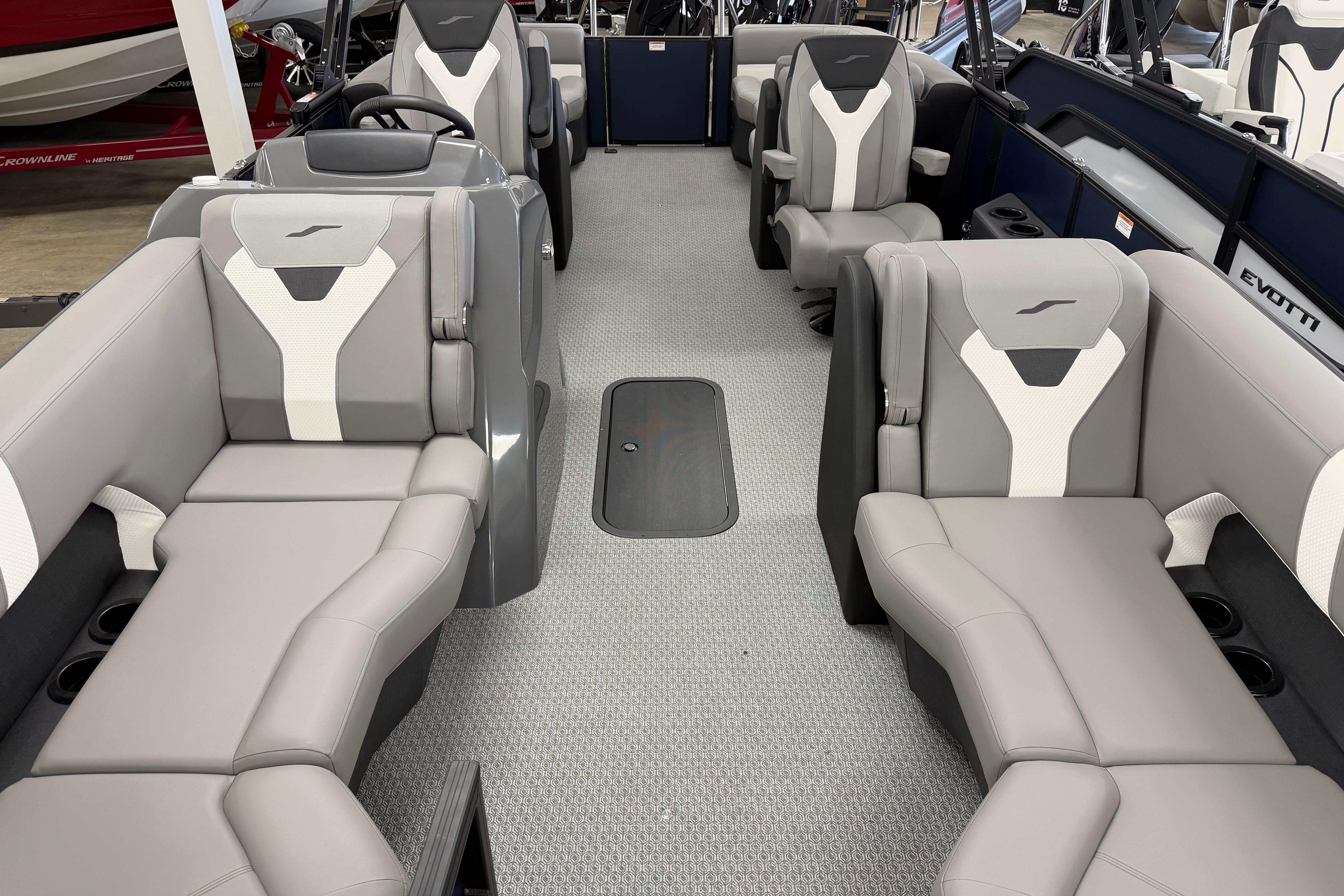 Luxurious interior of 2026 Evotti 523QL boat with modern seating and sleek design.
