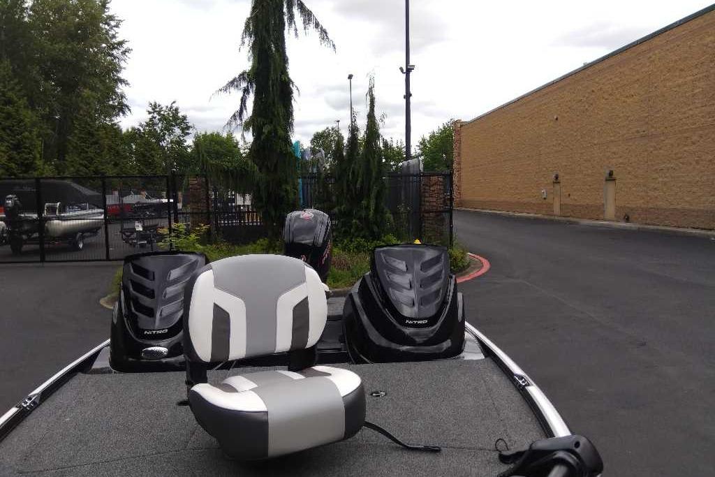 2026 Nitro Z17 boat with dual engines and seating, parked outdoors.