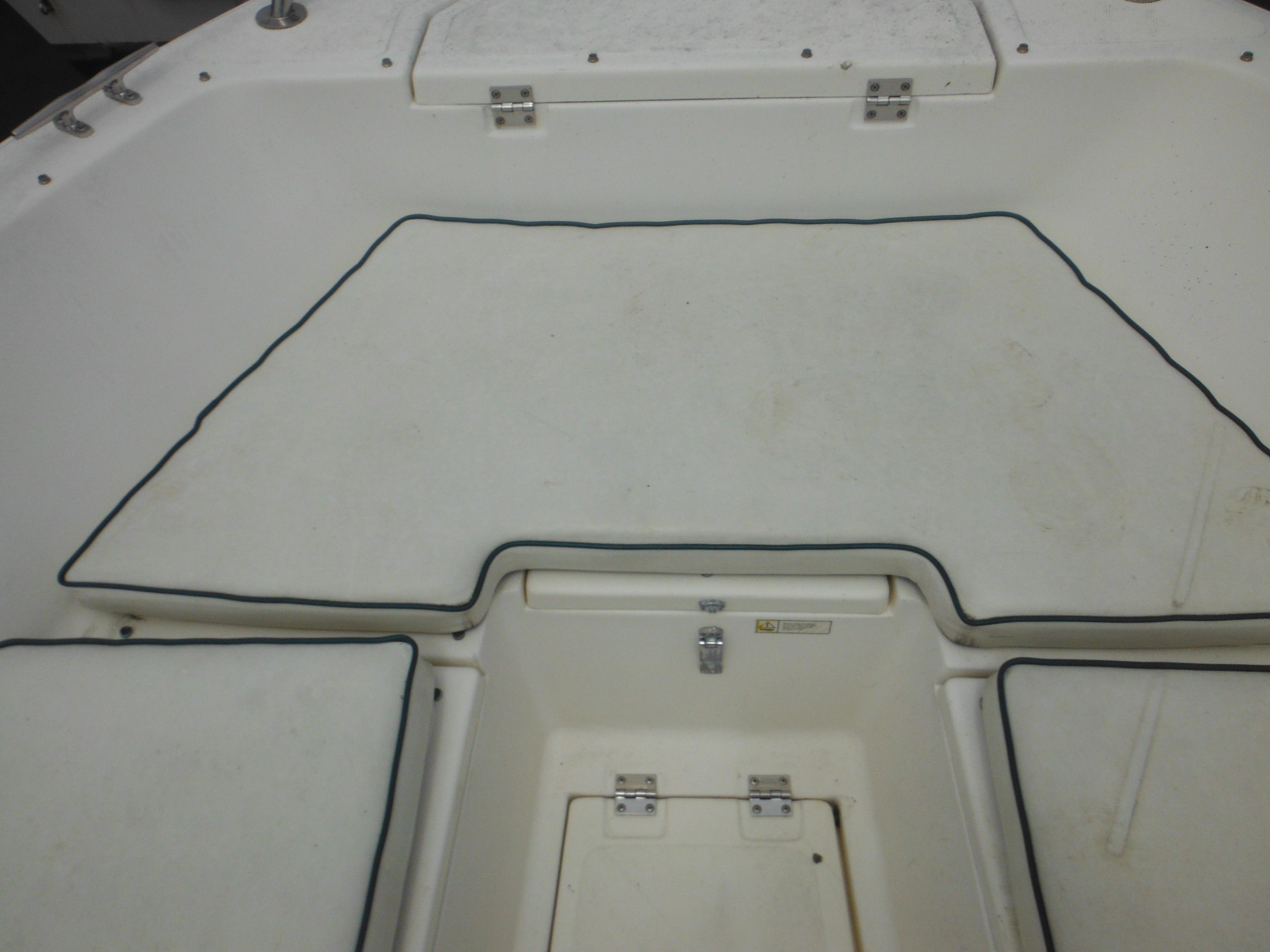 1996 Hydra-Sports 2000 DC boat interior with cushioned seating and storage compartments.