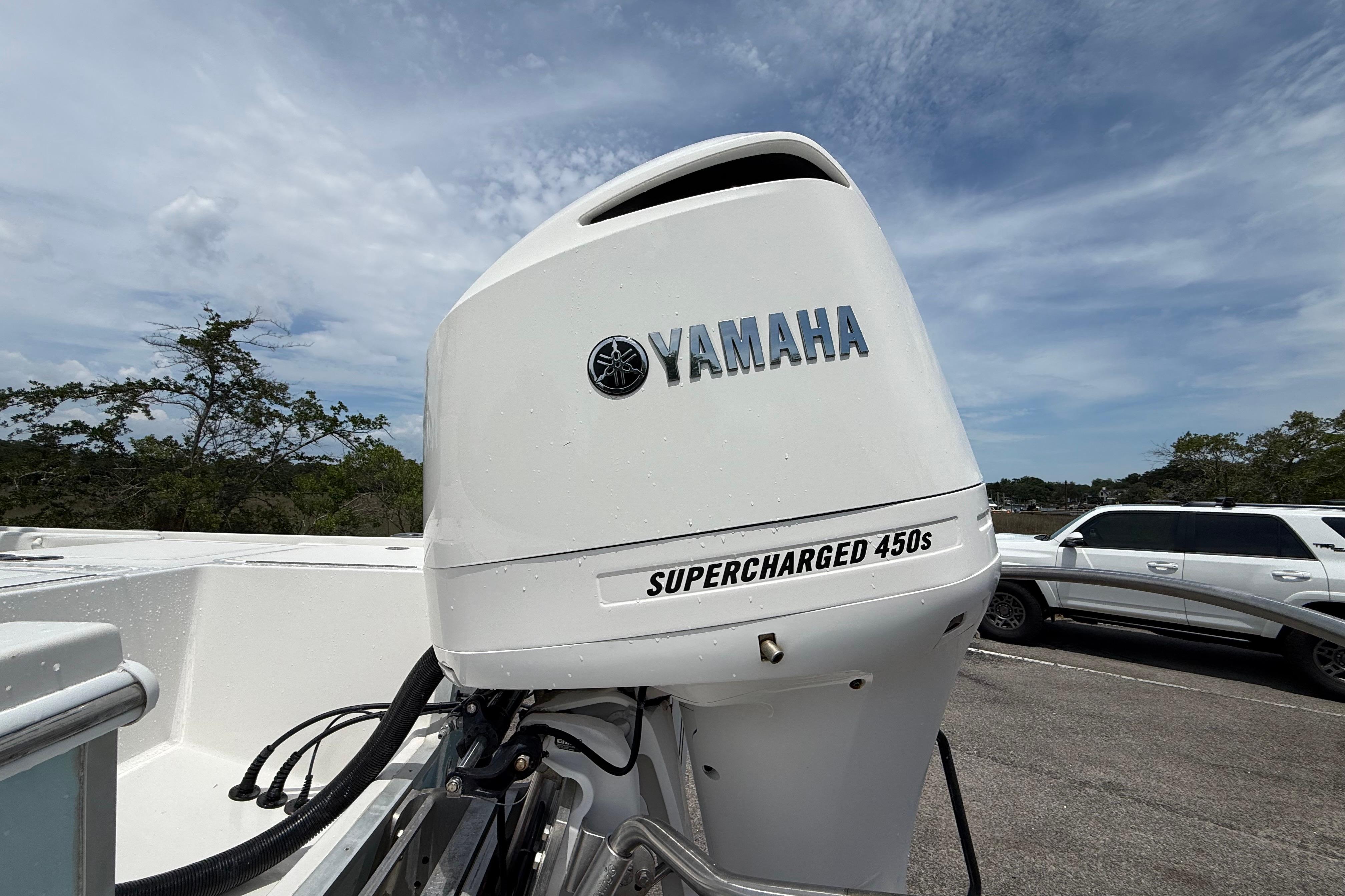 Yamaha Supercharged 450s engine on 2019 Regulator 26XO boat, parked outdoors.
