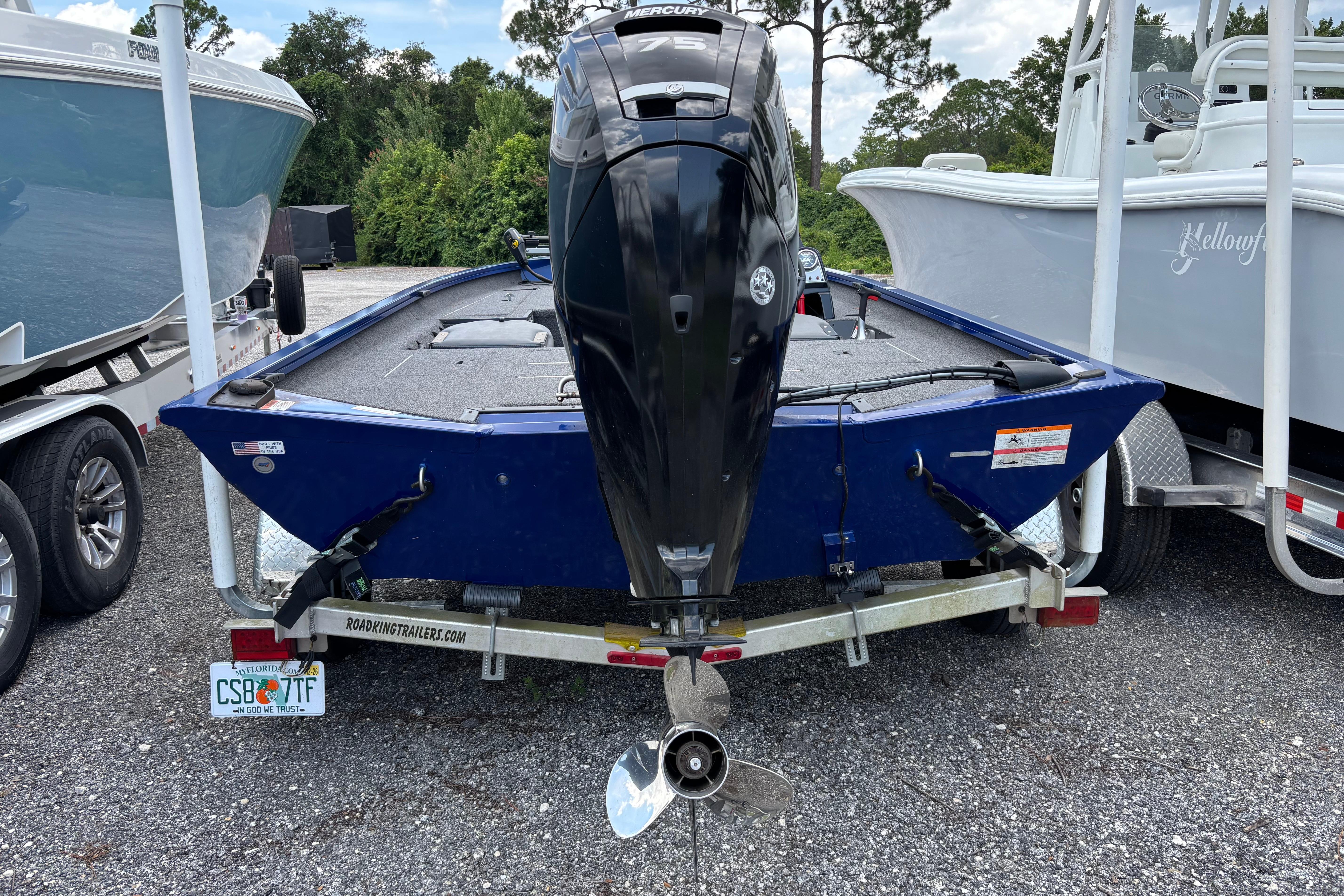2021 Lowe Stinger 175C boat on trailer, featuring a powerful outboard motor.