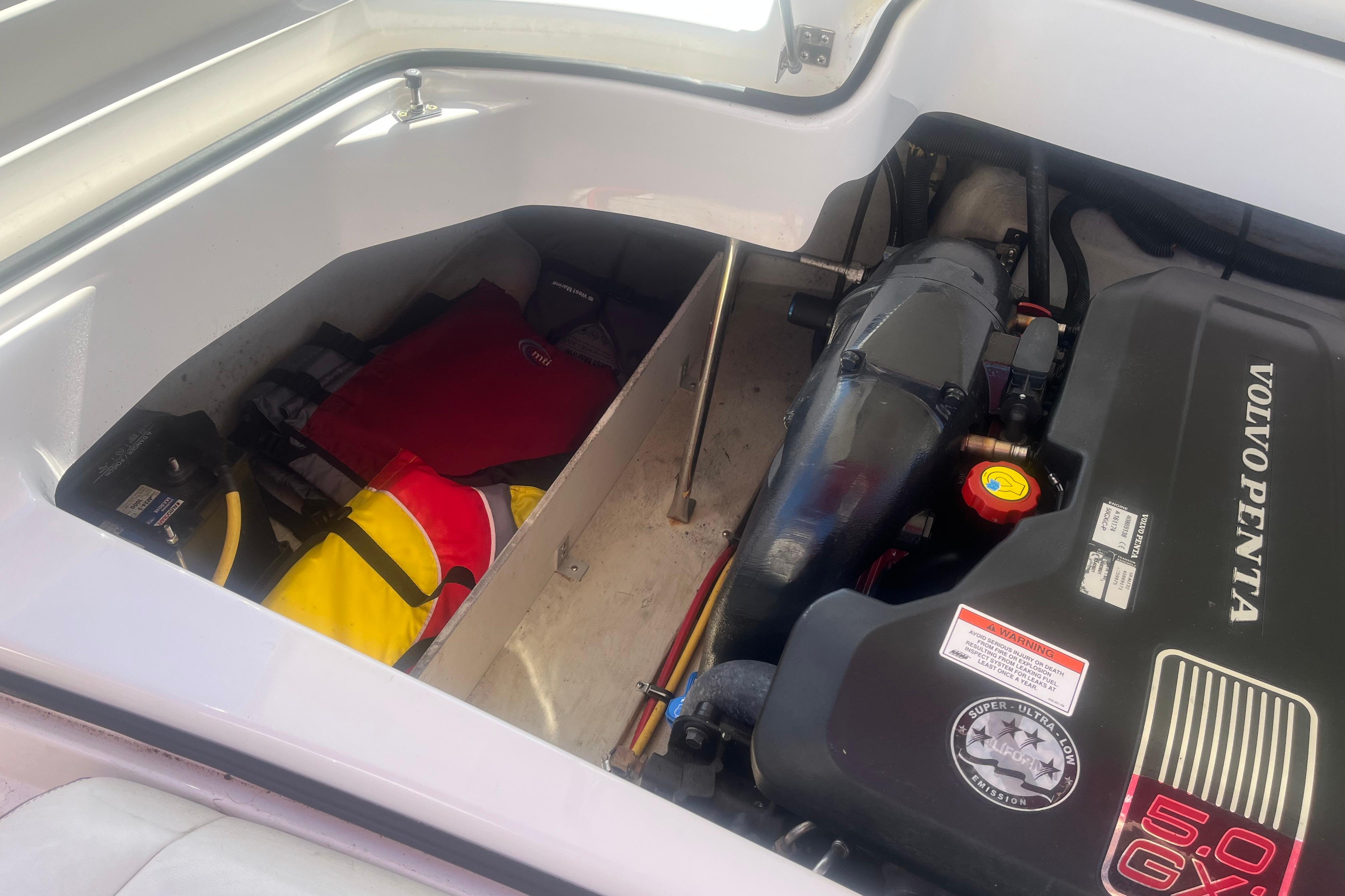 Engine compartment of a 2011 Cobalt 210 boat with Volvo Penta 5.0 GXI engine.